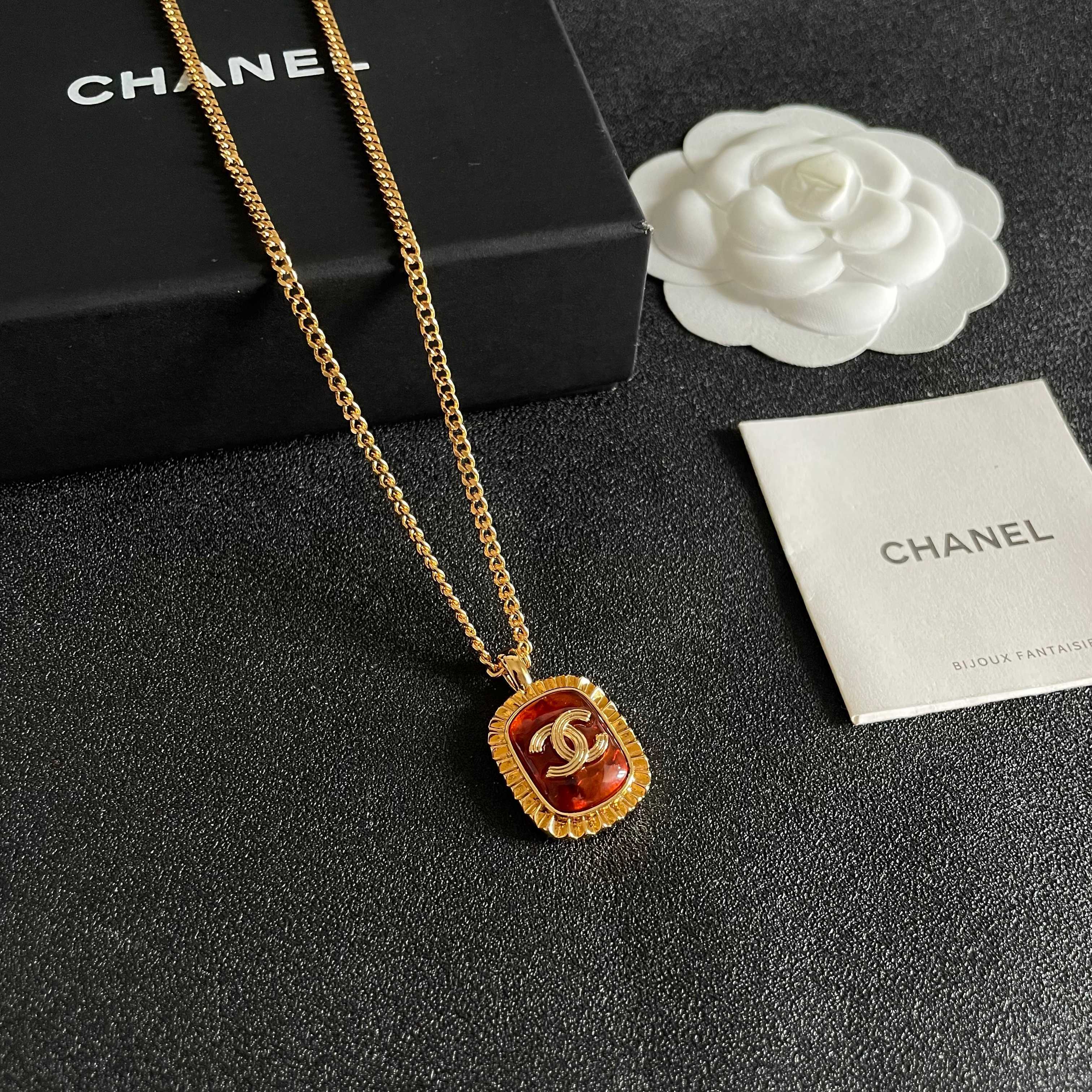 Chanel CC Logo Amber Resin Pendant necklace Gold-tone metal with amber orange resin 45cm
