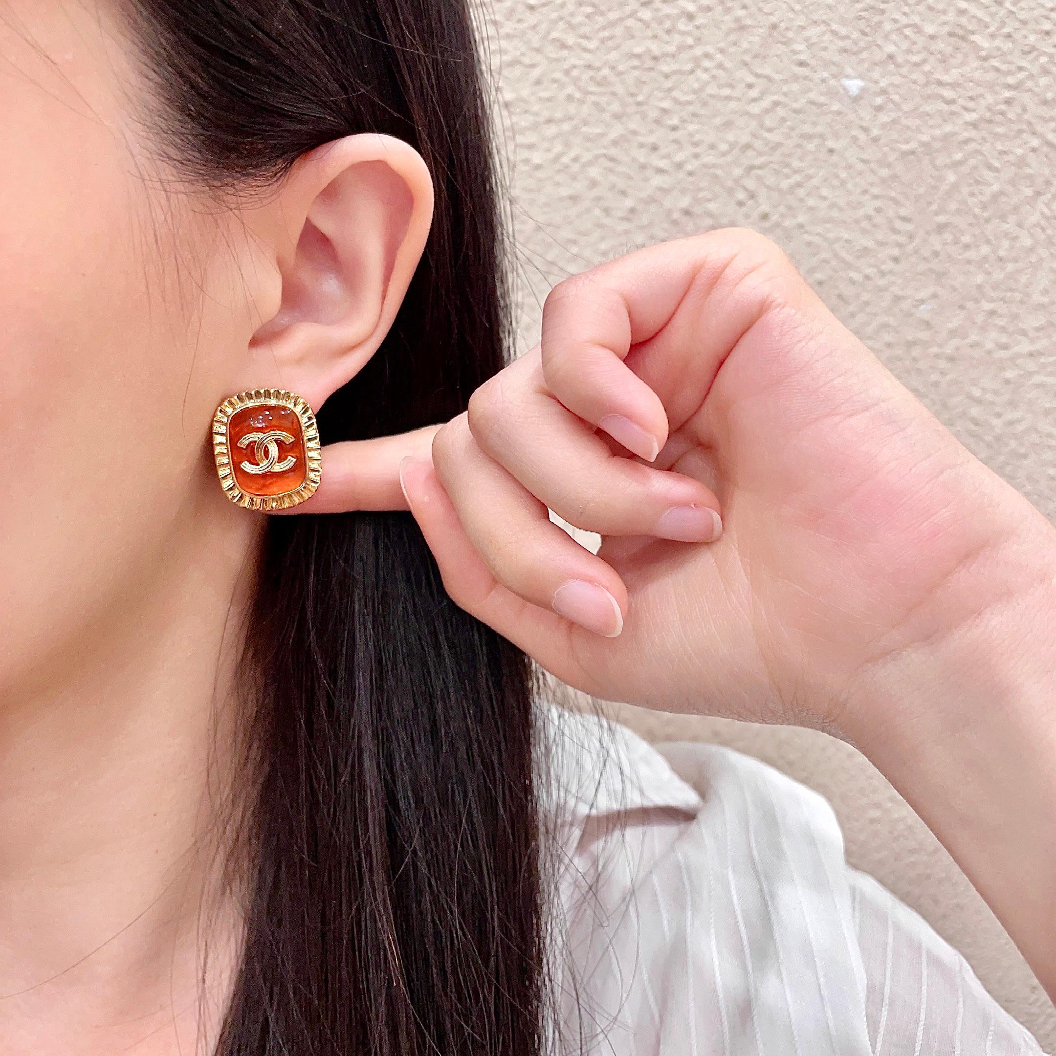 Chanel CC Logo Ribbed Edge Resin Stud Earrings earrings gold-tone metal orange resin 2cm diameter
