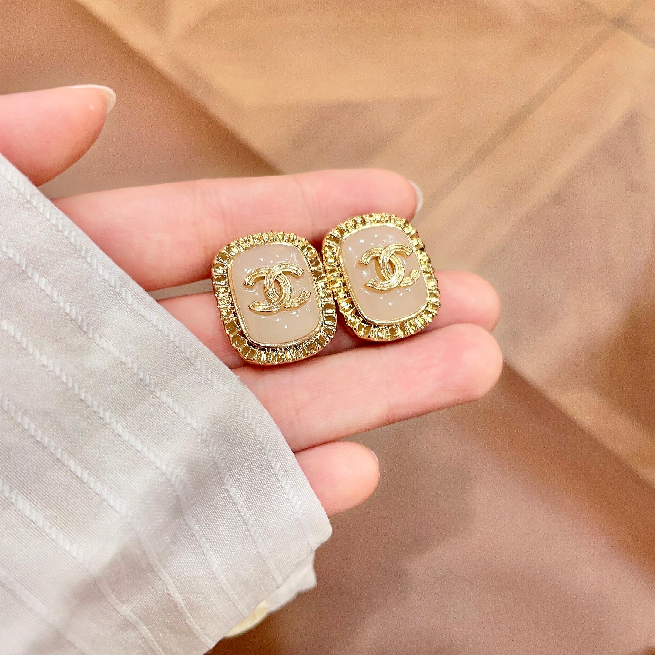 Chanel CC Logo Ribbed Edge Resin Stud Earrings earrings gold-tone metal light pink resin 2cm diameter