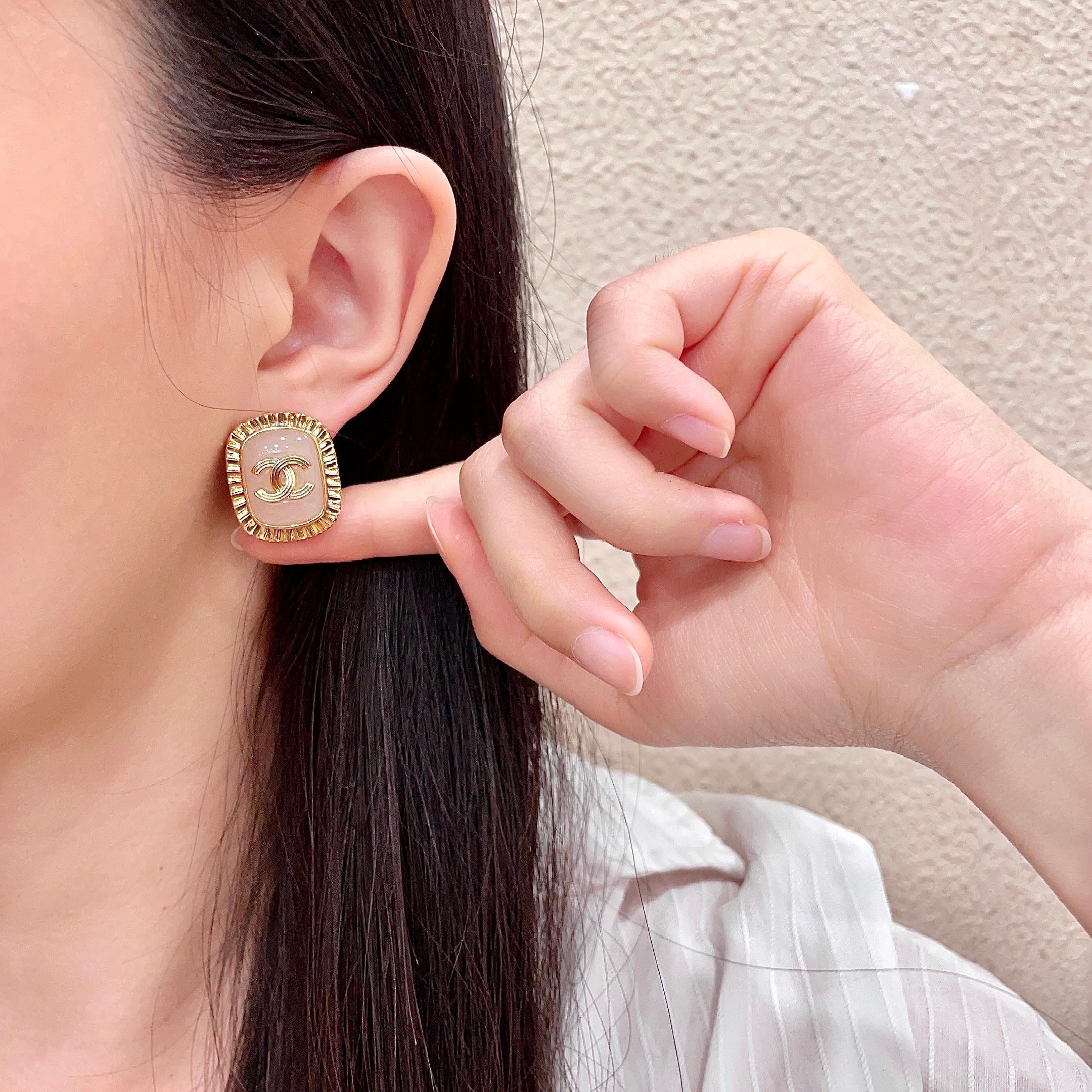 Chanel CC Logo Ribbed Edge Resin Stud Earrings earrings gold-tone metal light pink resin 2cm diameter