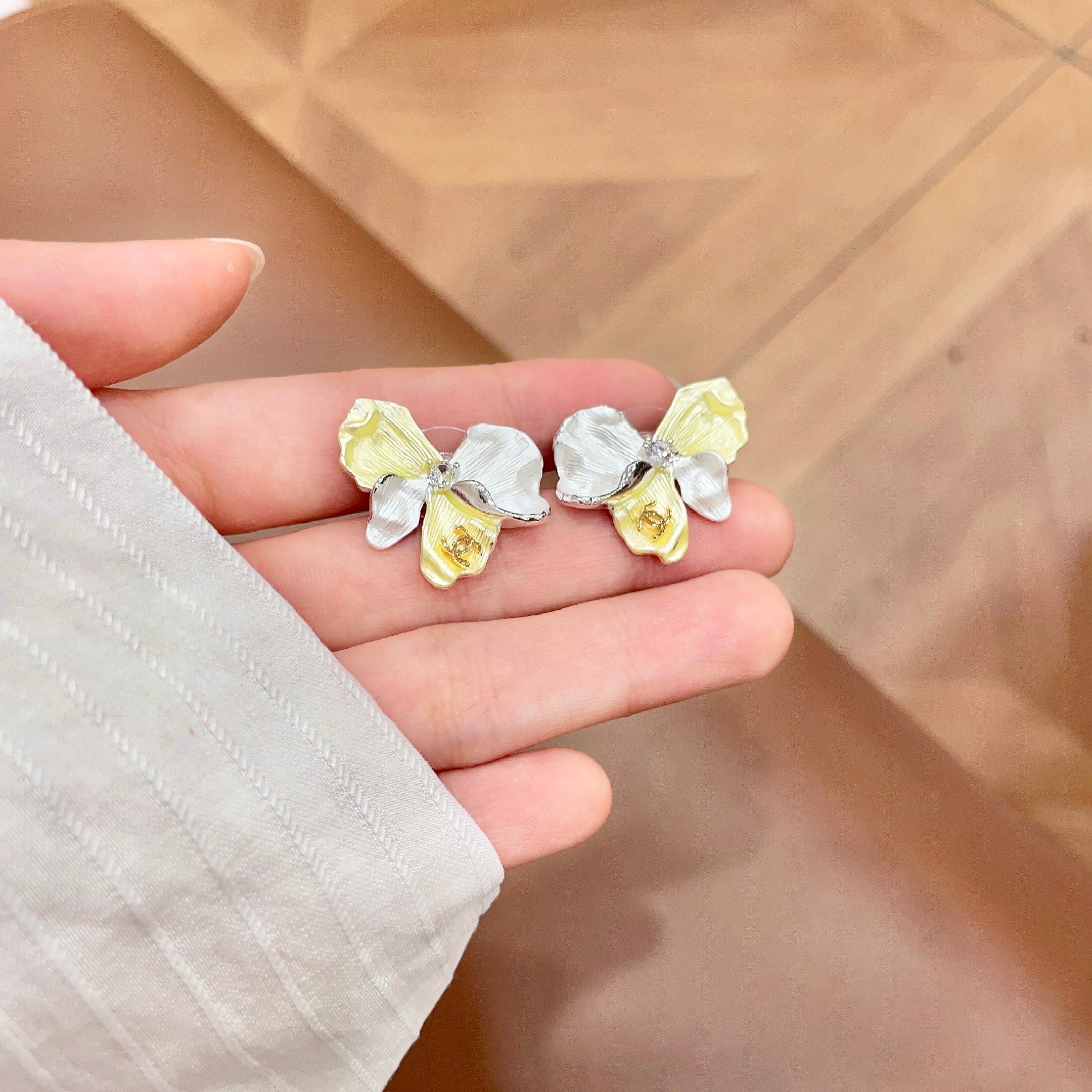 Chanel CC Logo Flower Stud Earrings earrings silver-toned metal pale yellow enamel white enamel clear crystal accents 2cm stud diameter