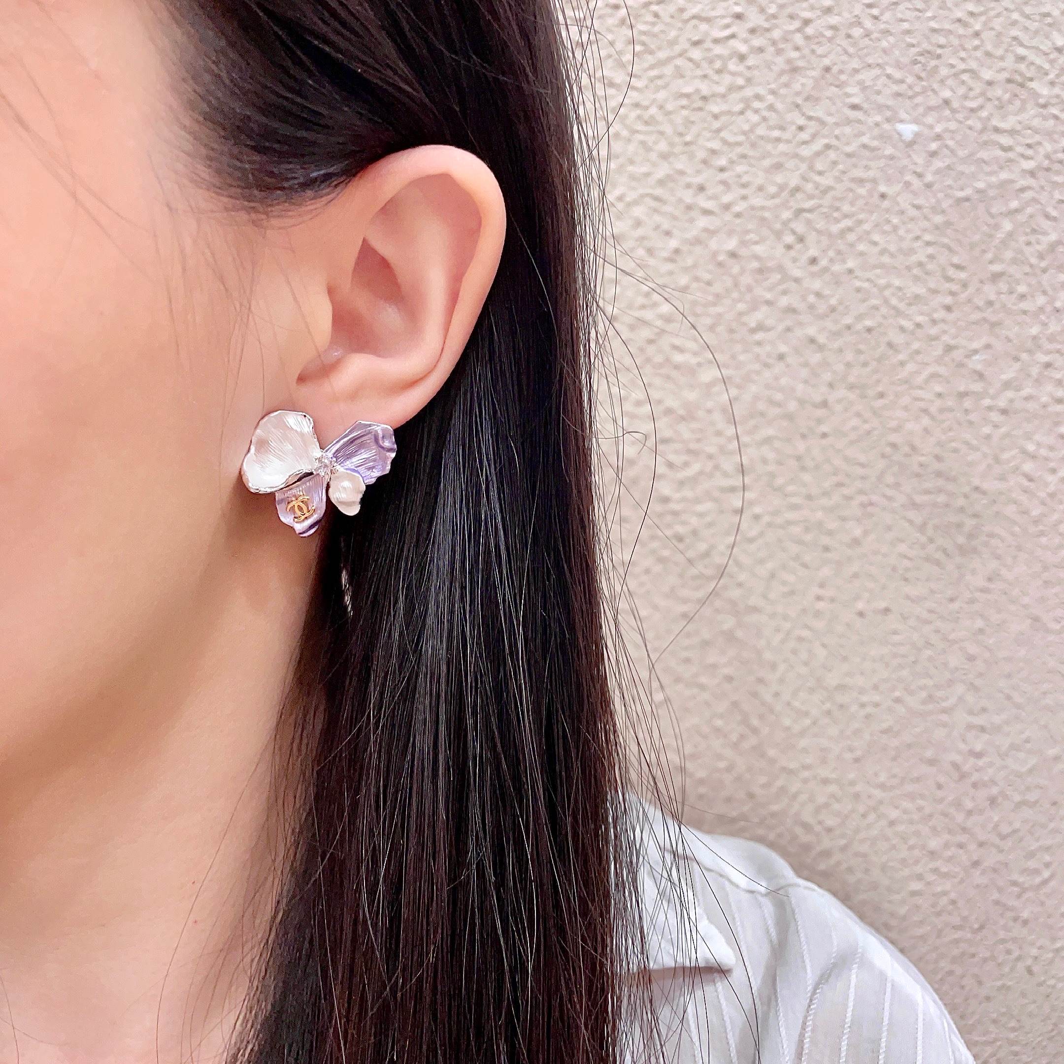 Chanel CC Logo Iridescent Flower Stud Earrings earrings Silver-toned metal pearlescent white lavender purple rose gold CC logo clear crystal accent white pearl accent 2cm stud diameter