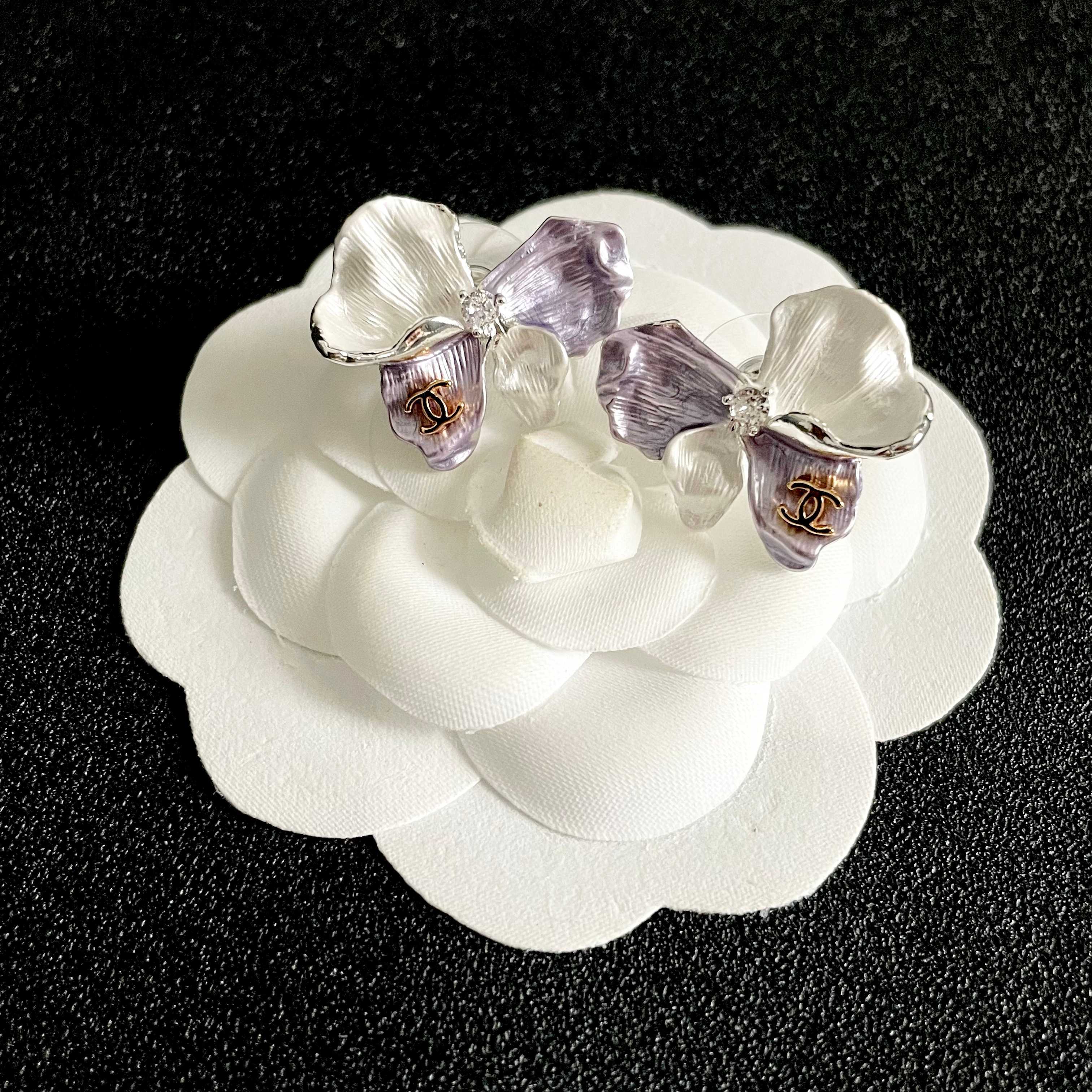 Chanel CC Logo Iridescent Flower Stud Earrings earrings Silver-toned metal pearlescent white lavender purple rose gold CC logo clear crystal accent white pearl accent 2cm stud diameter