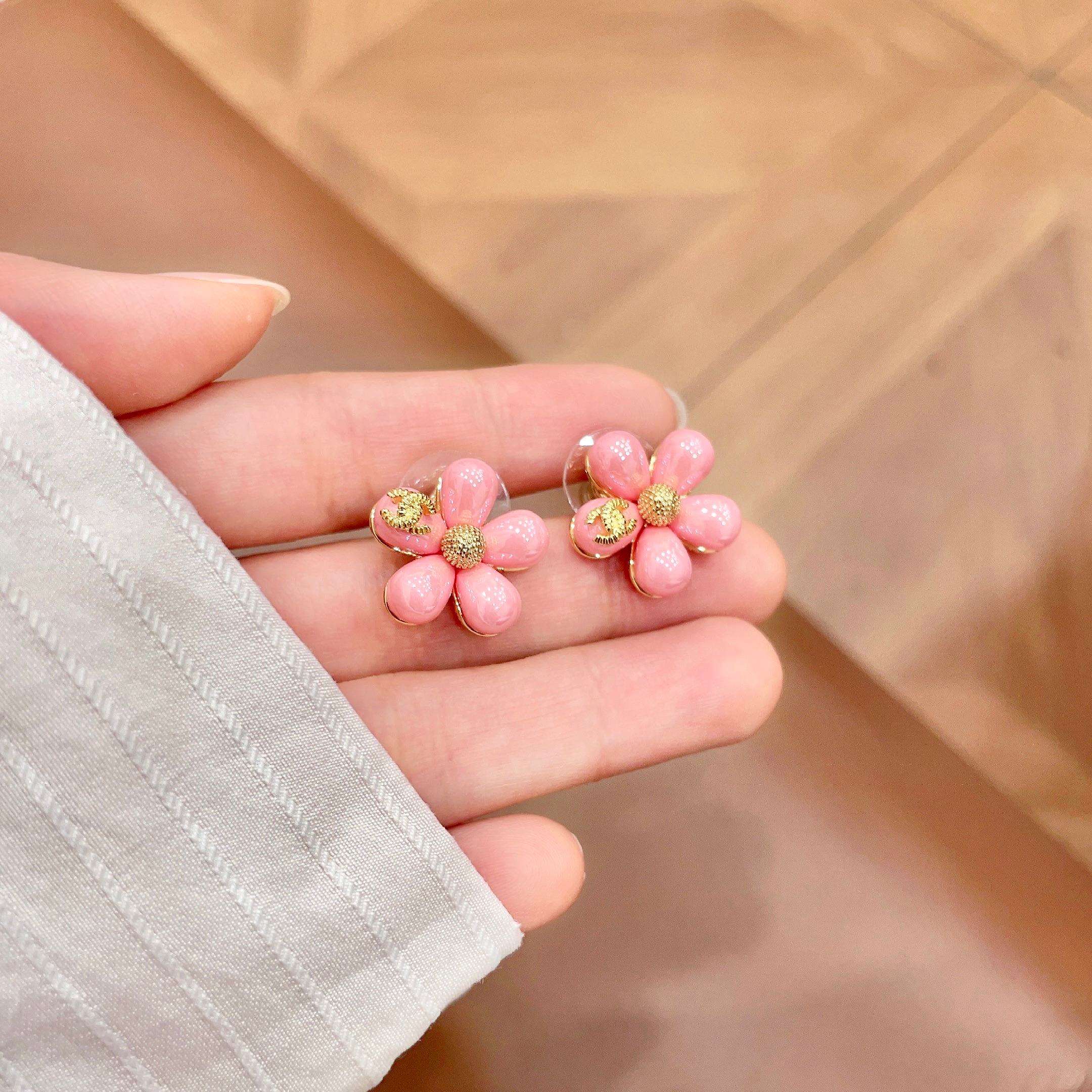 Chanel CC Flower Stud Earrings earrings Gold-tone metal with pastel pink and light blue resin flower accents 1 5cm diameter