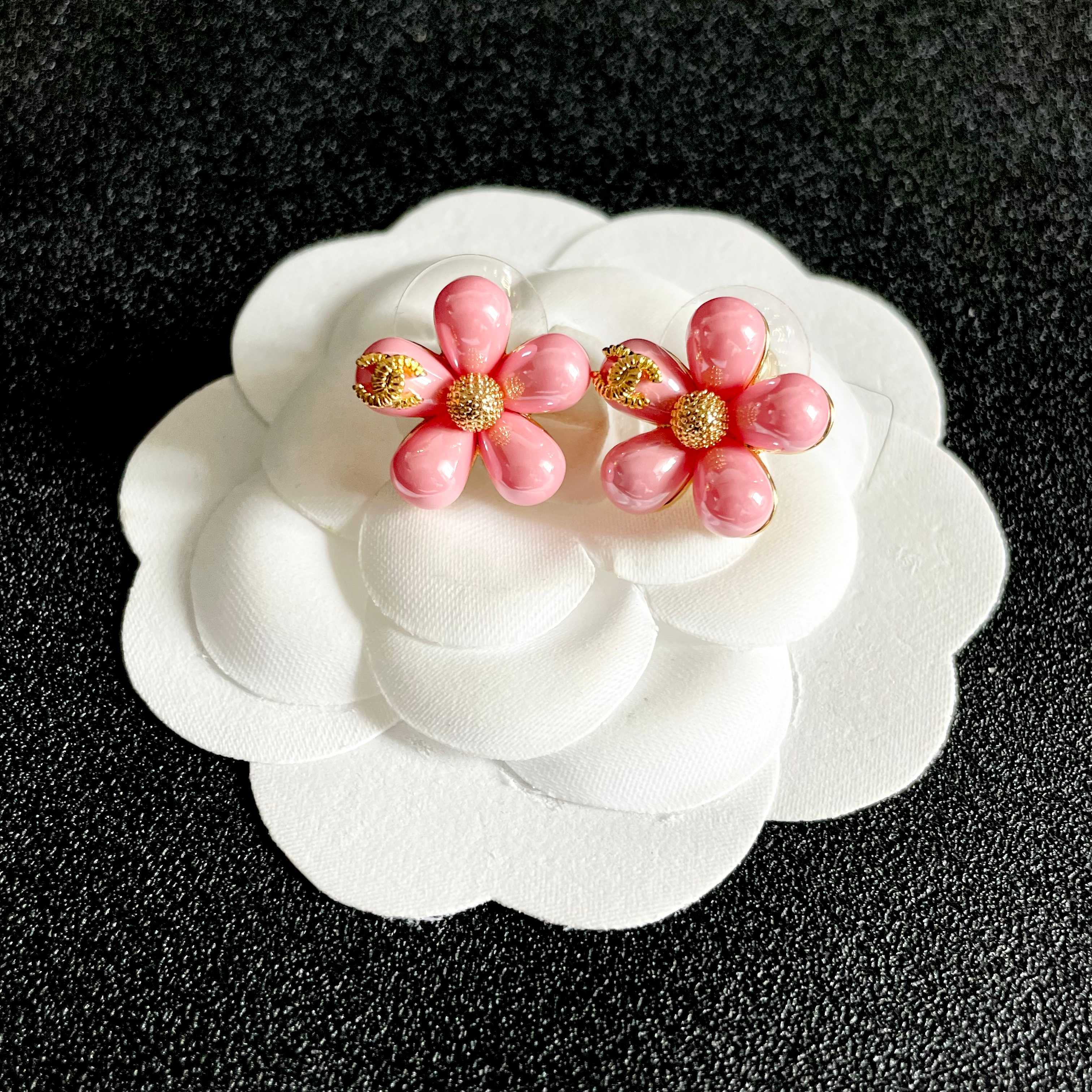 Chanel CC Flower Stud Earrings earrings Gold-tone metal with pastel pink and light blue resin flower accents 1 5cm diameter