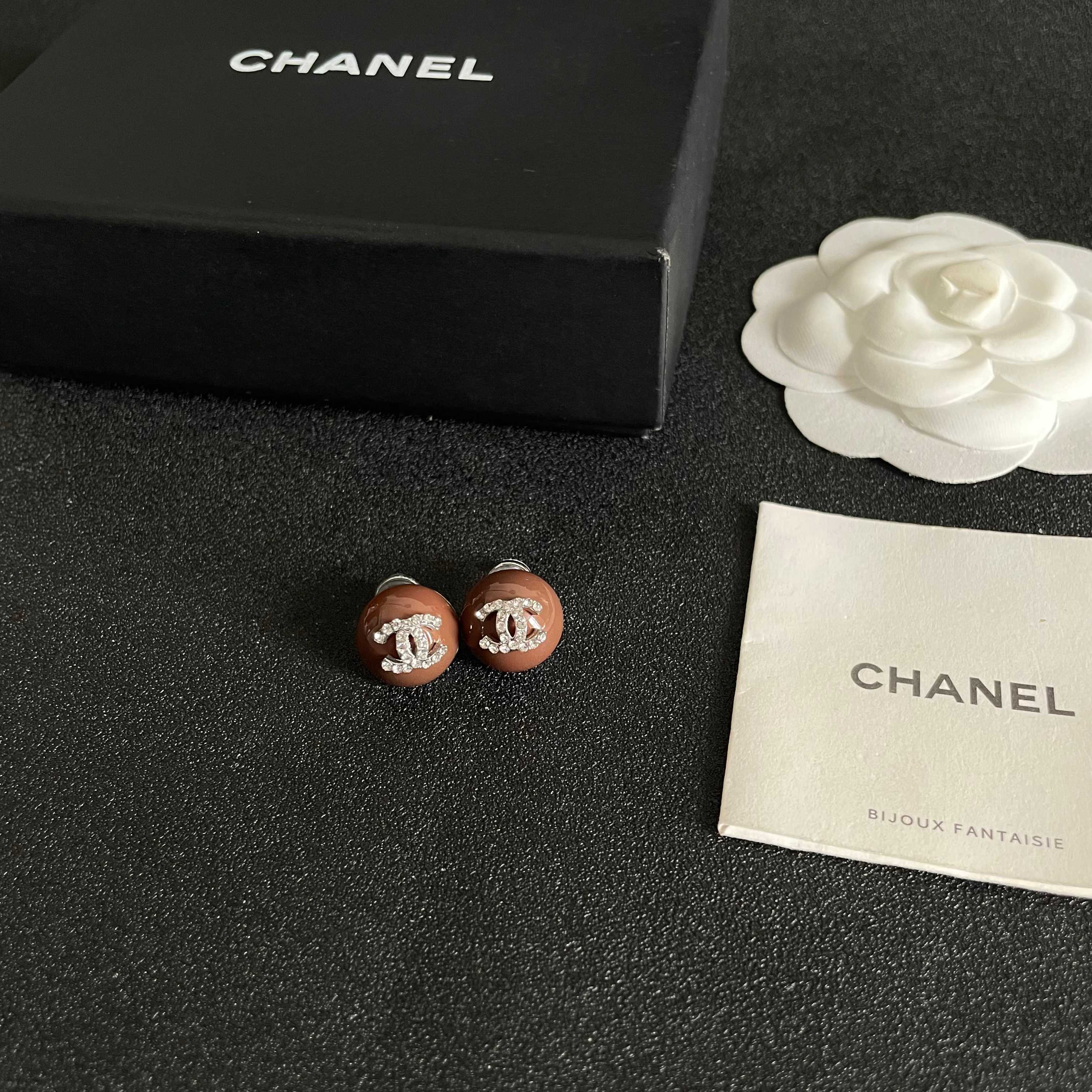 Chanel CC Logo Round Stud Earrings earrings brown resin base with silver-tone metal and clear crystal CC logo 1 2cm diameter