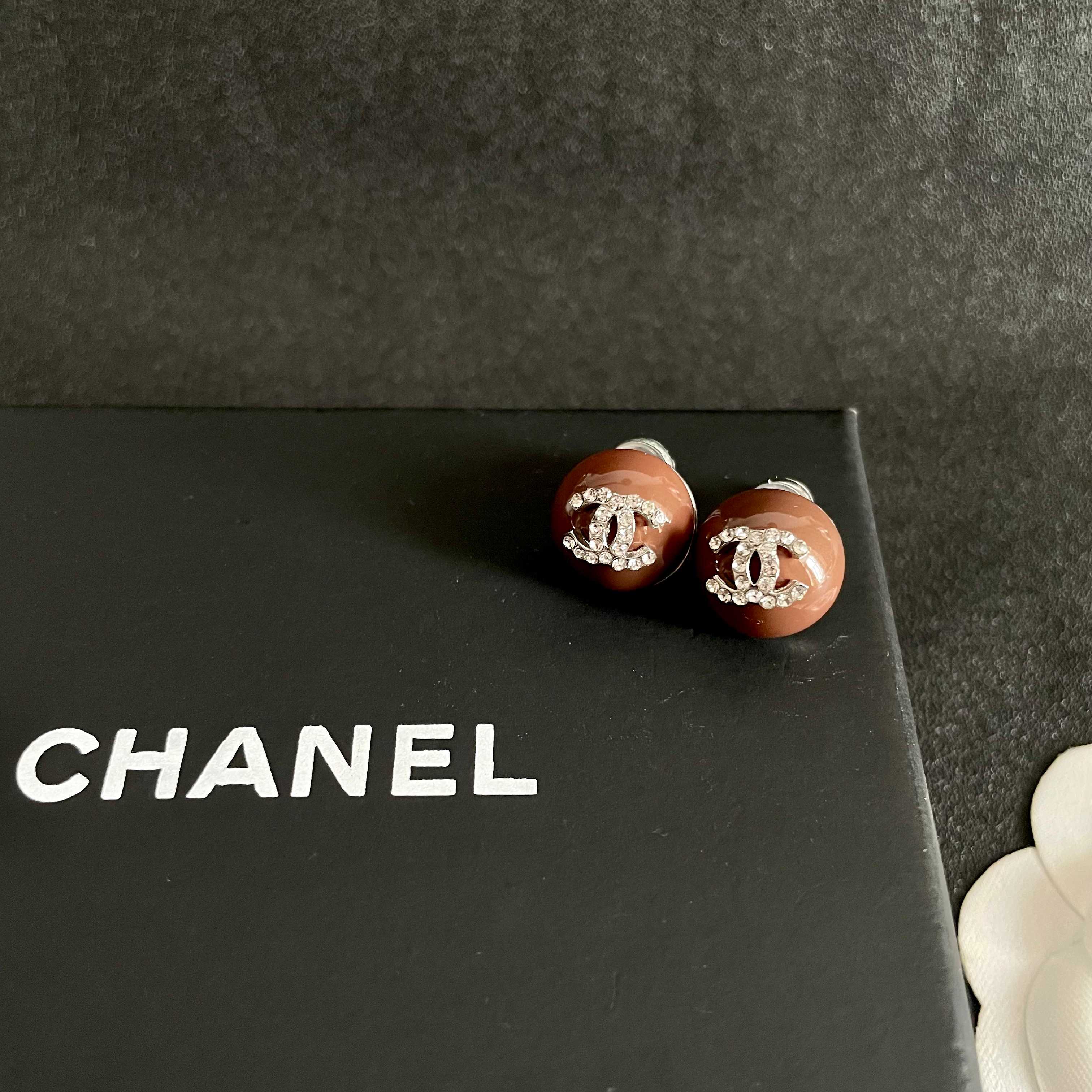 Chanel CC Logo Round Stud Earrings earrings brown resin base with silver-tone metal and clear crystal CC logo 1 2cm diameter