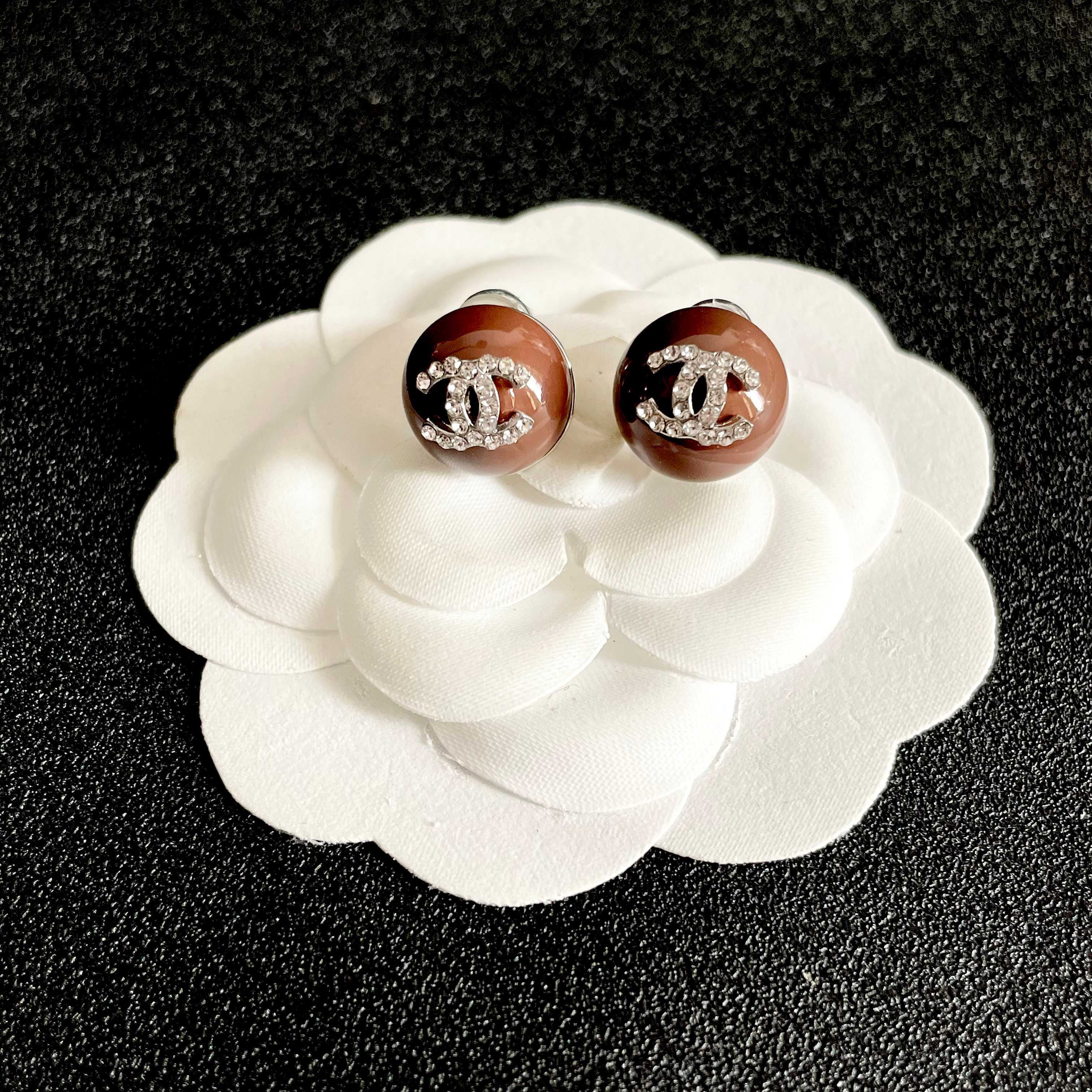 Chanel CC Logo Round Stud Earrings earrings brown resin base with silver-tone metal and clear crystal CC logo 1 2cm diameter