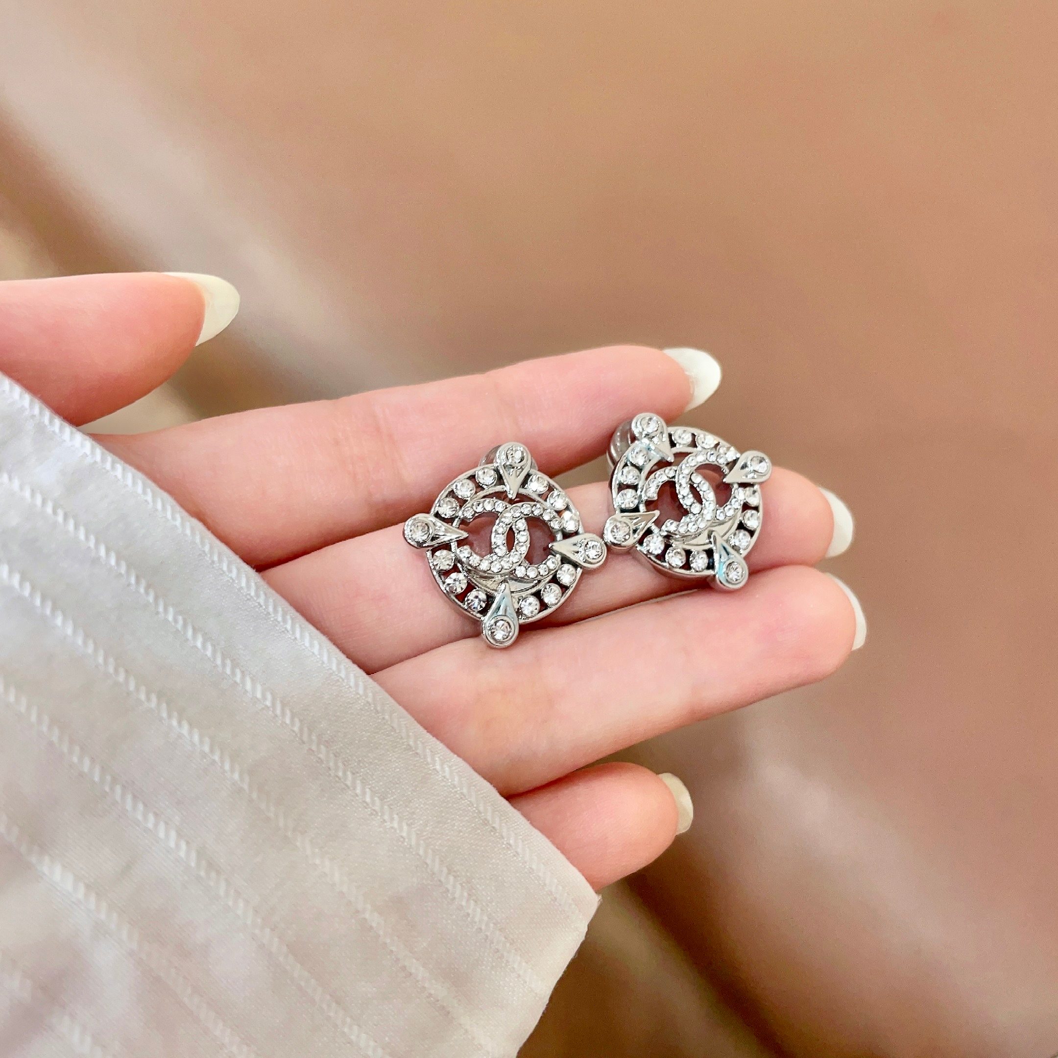Chanel CC Logo Crystal Compass Stud Earrings earrings silver-toned metal with clear crystal accents 1 5cm diameter