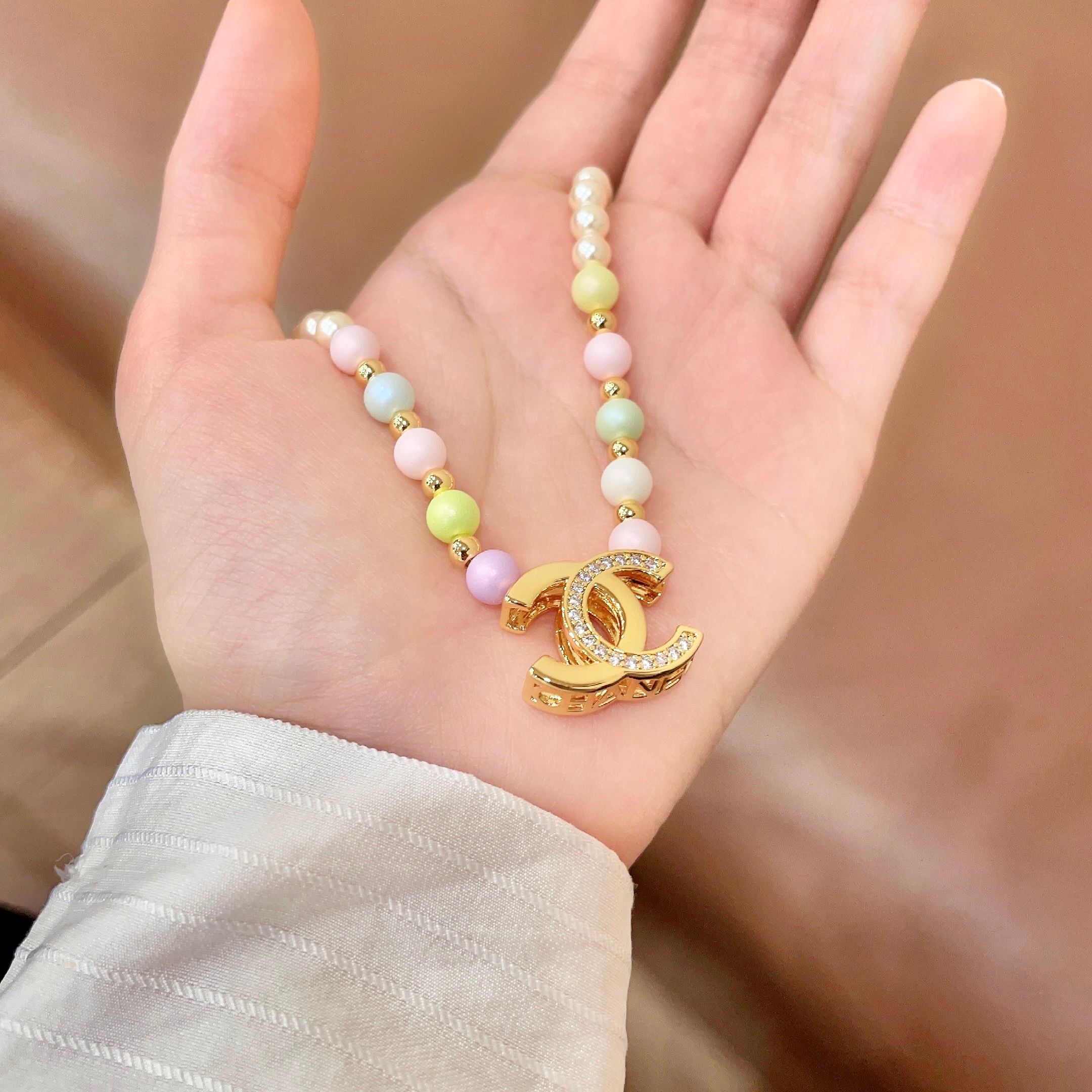 Chanel CC Logo Pastel Pearl Necklace necklace Gold-tone metal cream faux pearls pastel multicolor faux pearls clear crystal accents 42cm