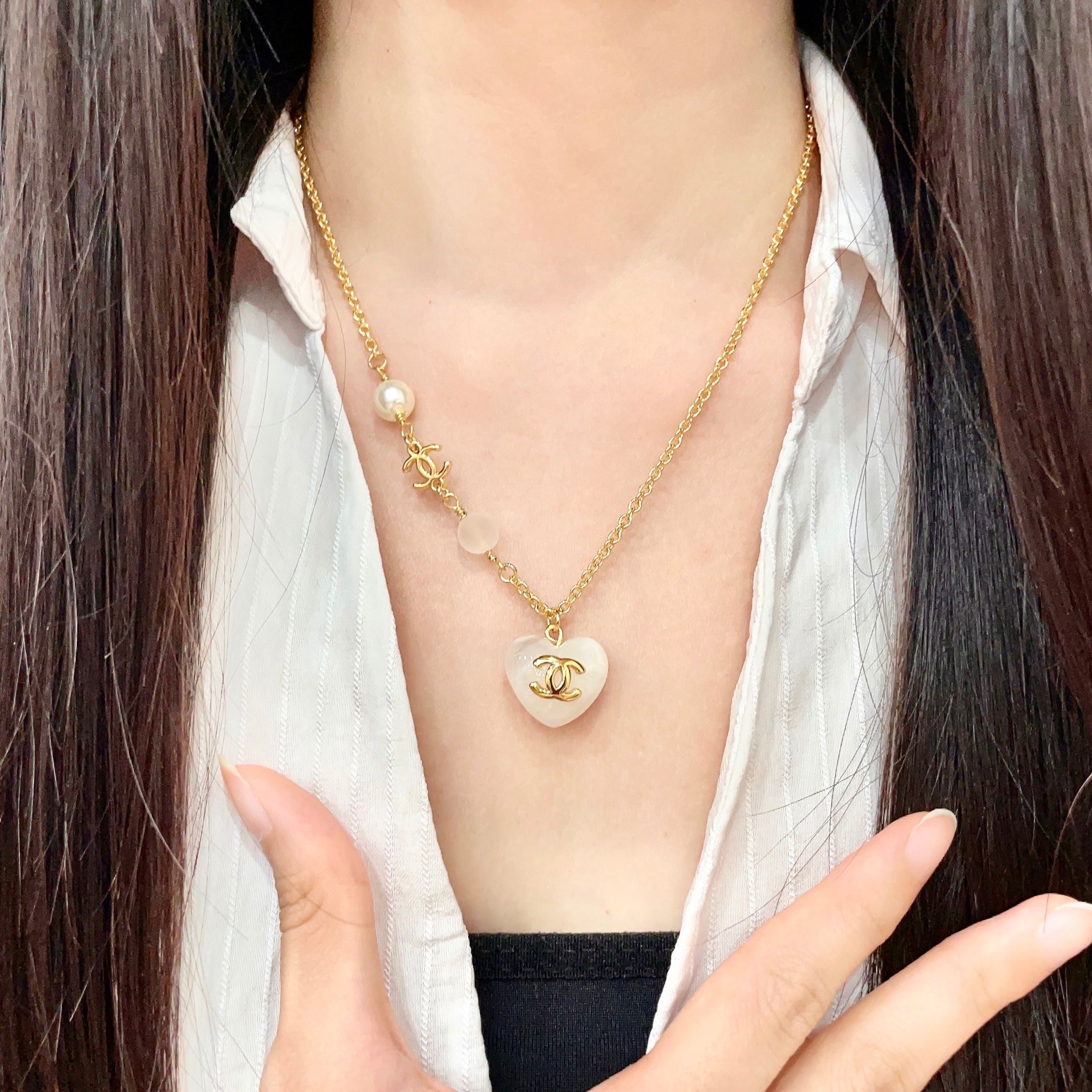 Chanel CC Heart Pendant necklace Gold-tone metal white resin heart white faux pearl frosted white bead 42cm
