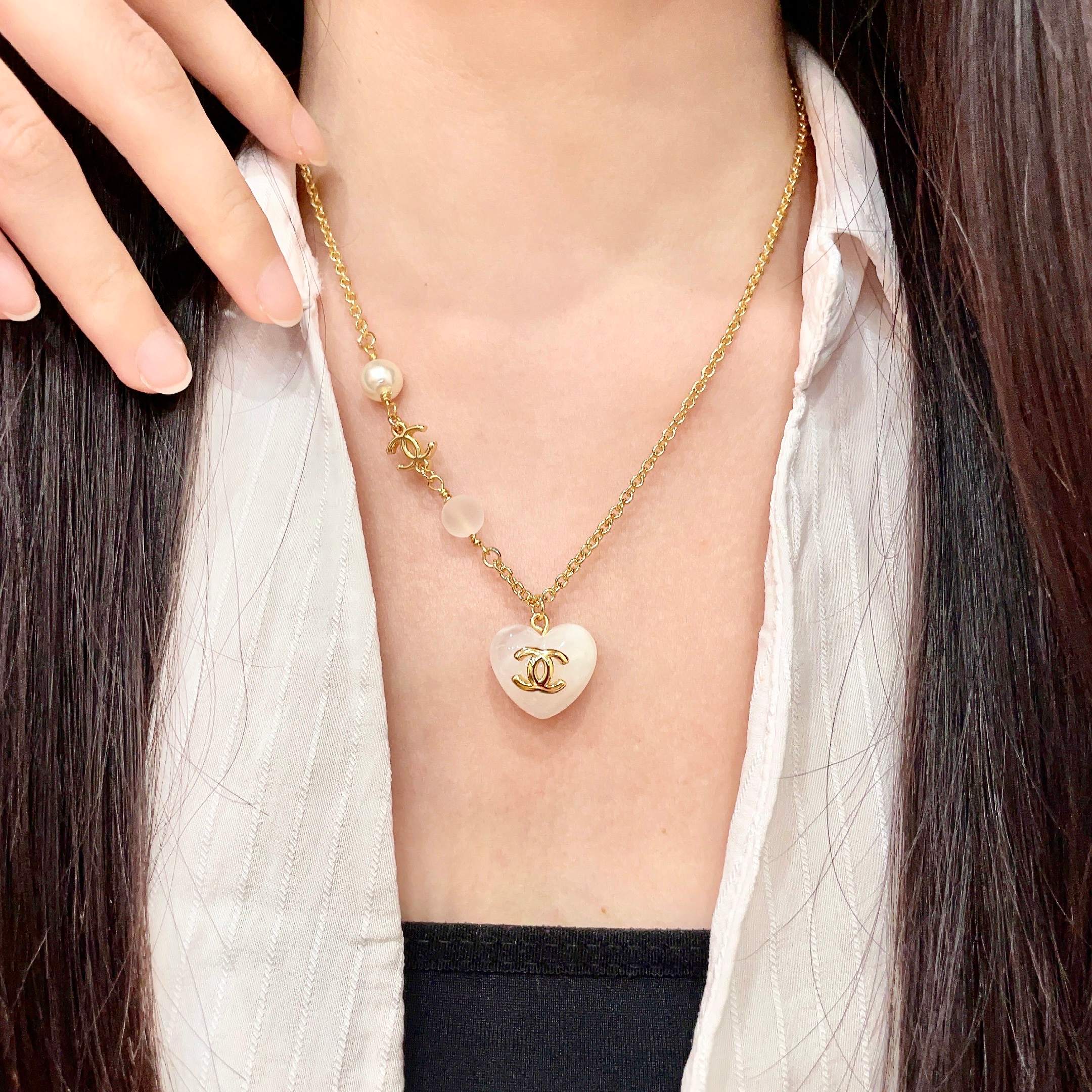 Chanel CC Heart Pendant necklace Gold-tone metal white resin heart white faux pearl frosted white bead 42cm