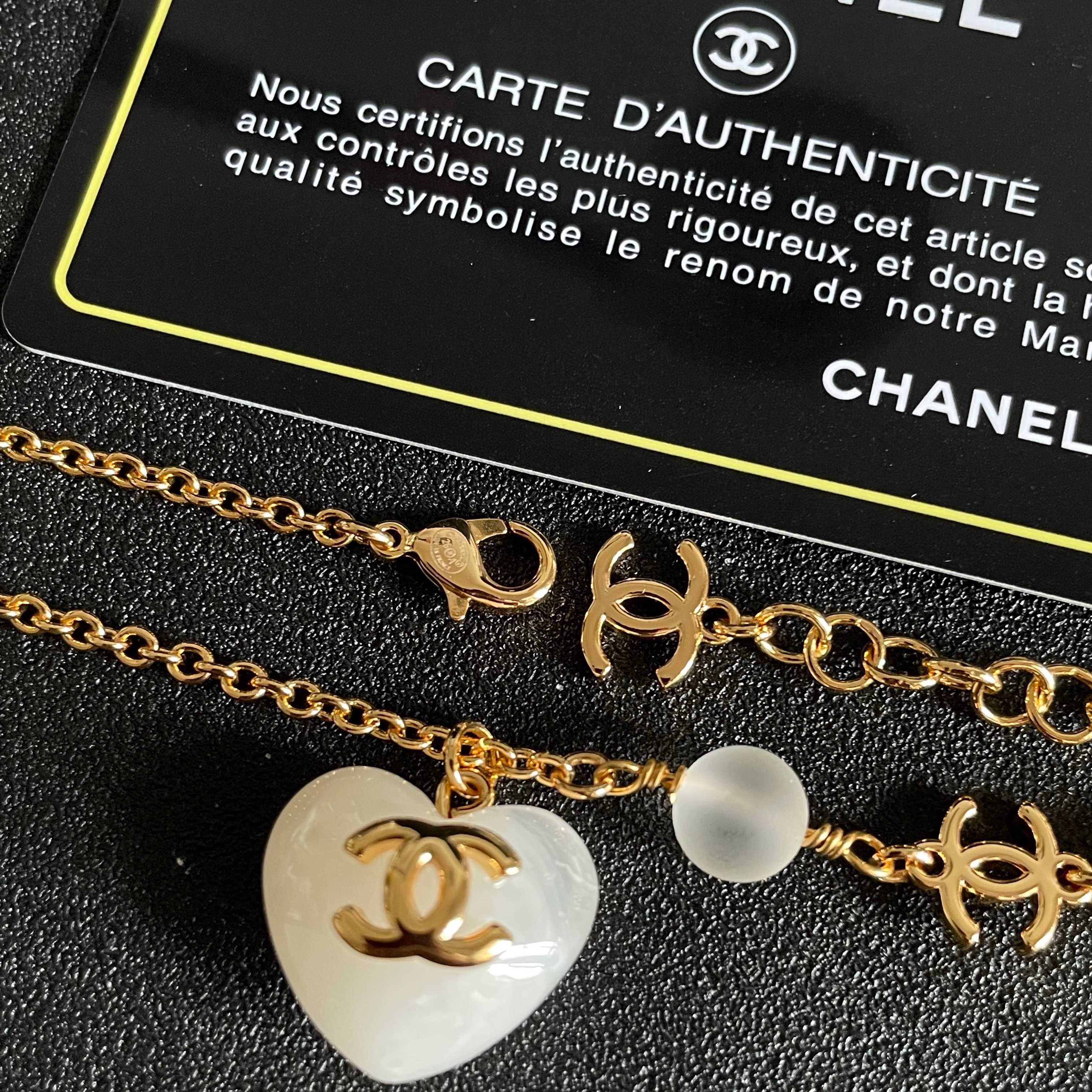 Chanel CC Heart Pendant necklace Gold-tone metal white resin heart white faux pearl frosted white bead 42cm