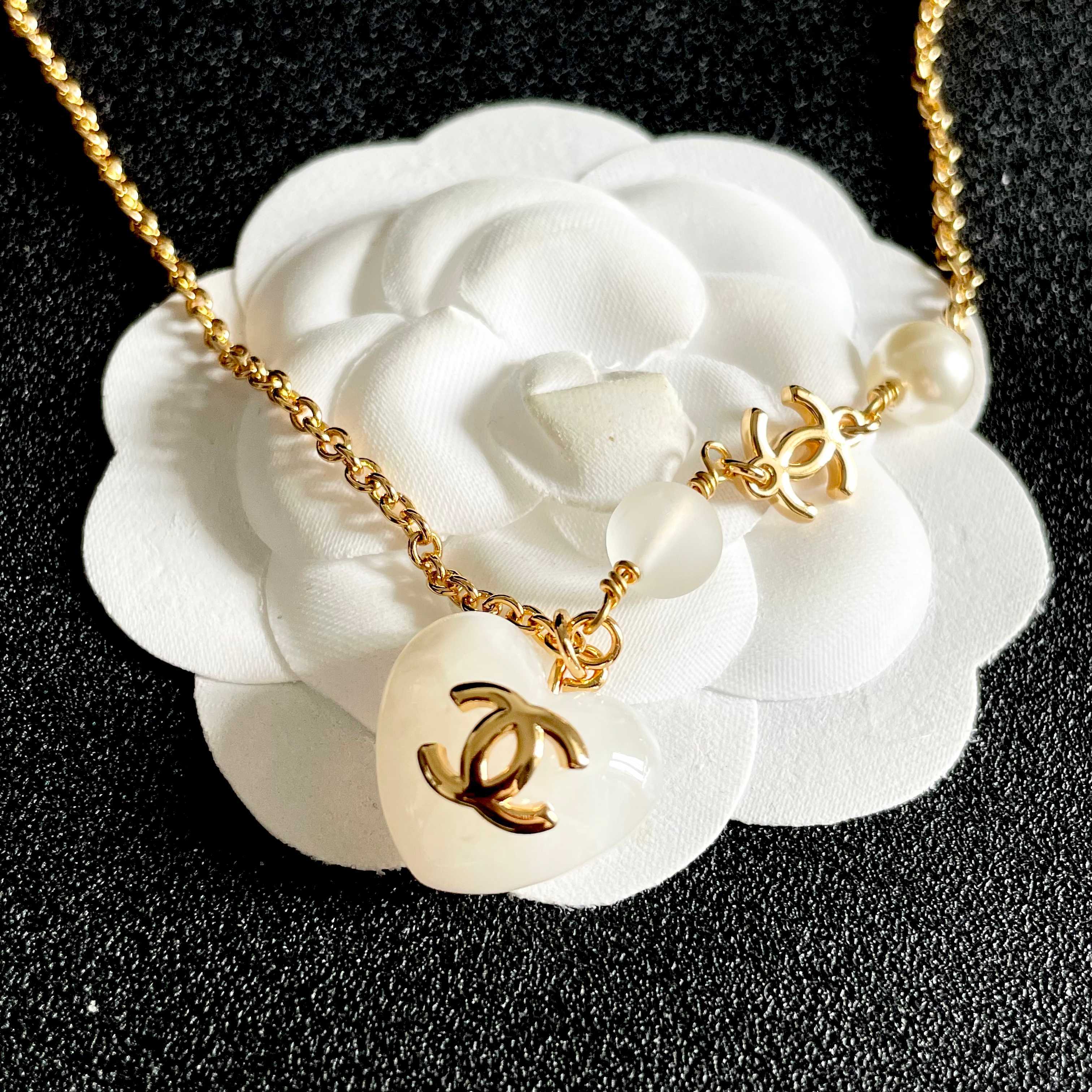 Chanel CC Heart Pendant necklace Gold-tone metal white resin heart white faux pearl frosted white bead 42cm