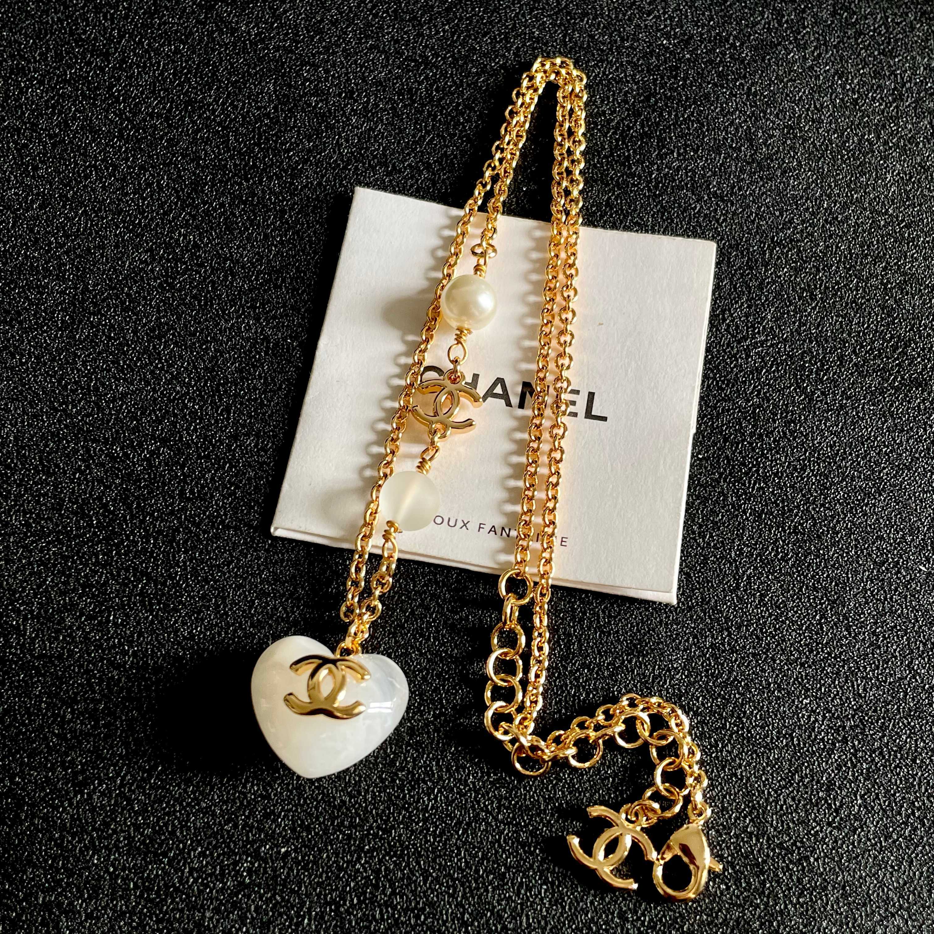 Chanel CC Heart Pendant necklace Gold-tone metal white resin heart white faux pearl frosted white bead 42cm
