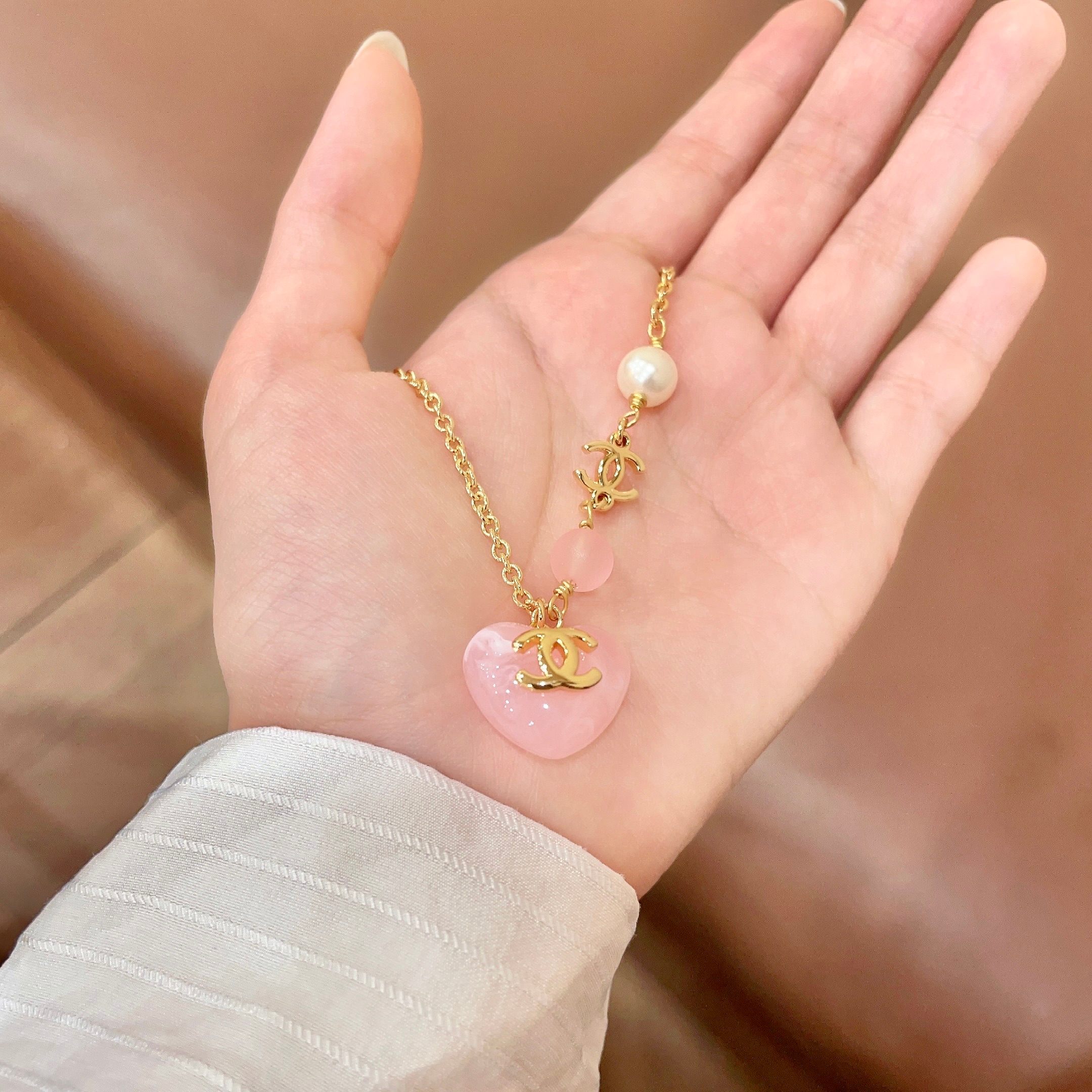 Chanel CC Heart Pendant Necklace necklace Gold-tone metal with cream faux pearl pink resin bead and pink resin heart pendant 42cm