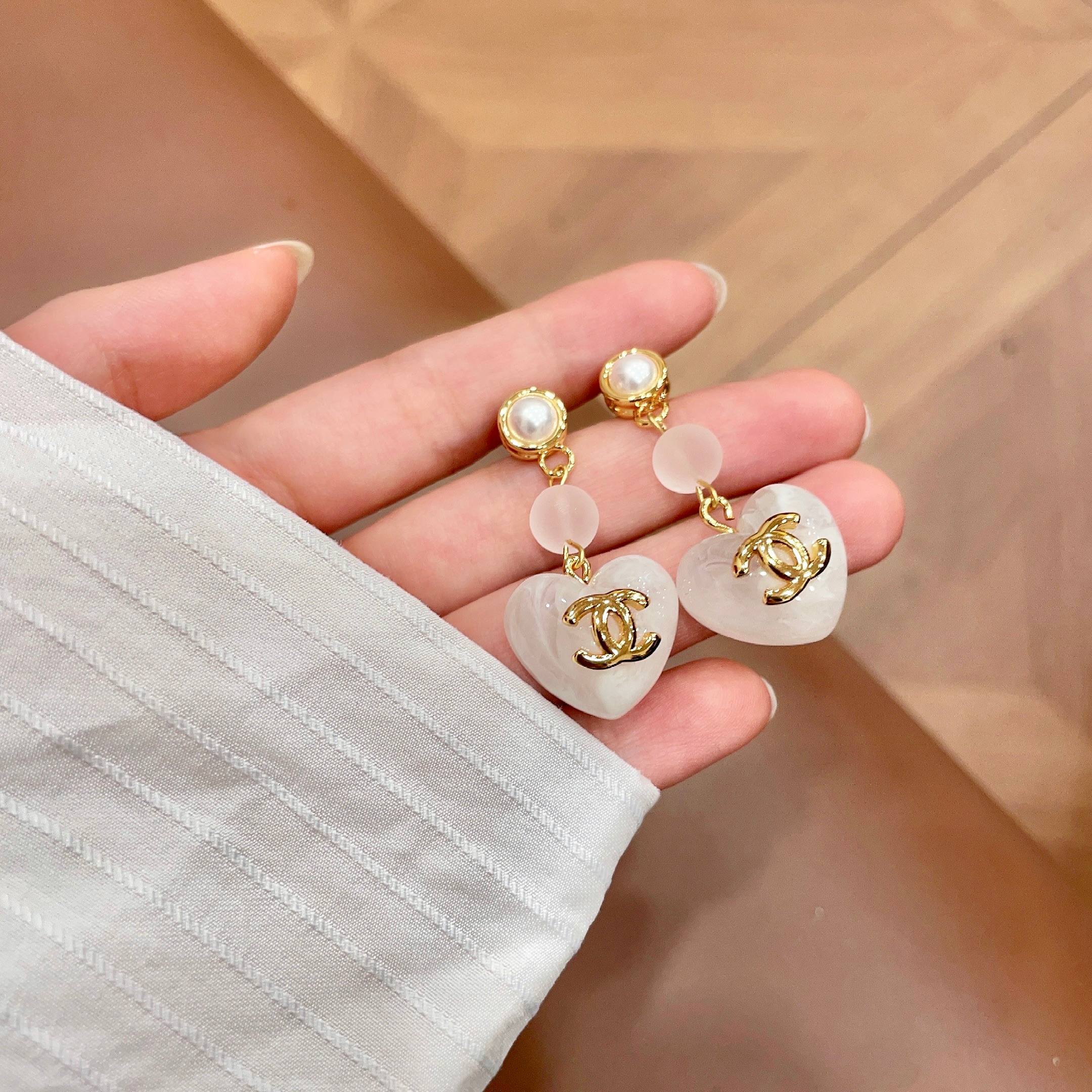 Chanel CC Heart Drop Earrings earrings gold-tone metal white mother-of-pearl effect resin white pearl accent 3 5cm drop length