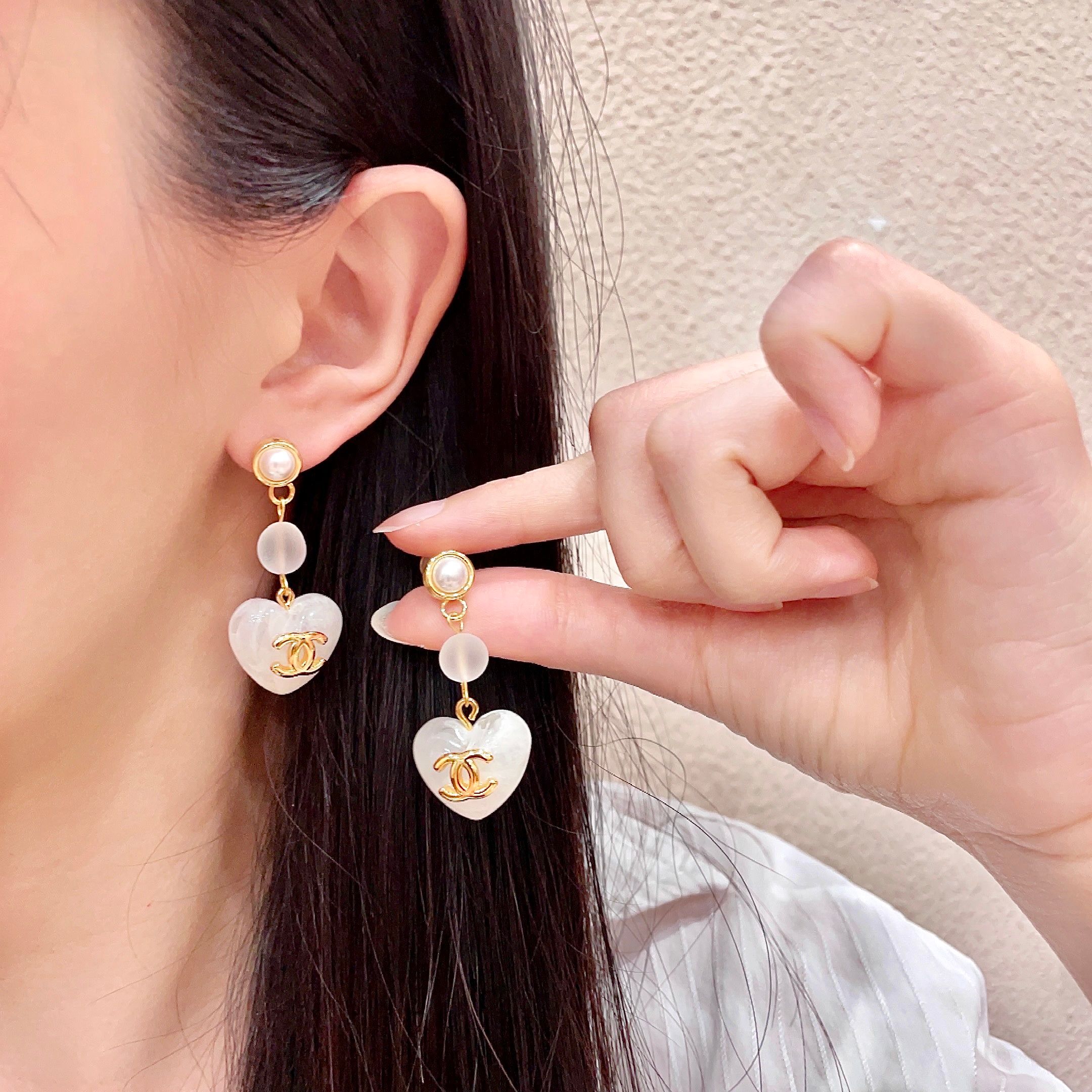 Chanel CC Heart Drop Earrings earrings gold-tone metal white mother-of-pearl effect resin white pearl accent 3 5cm drop length