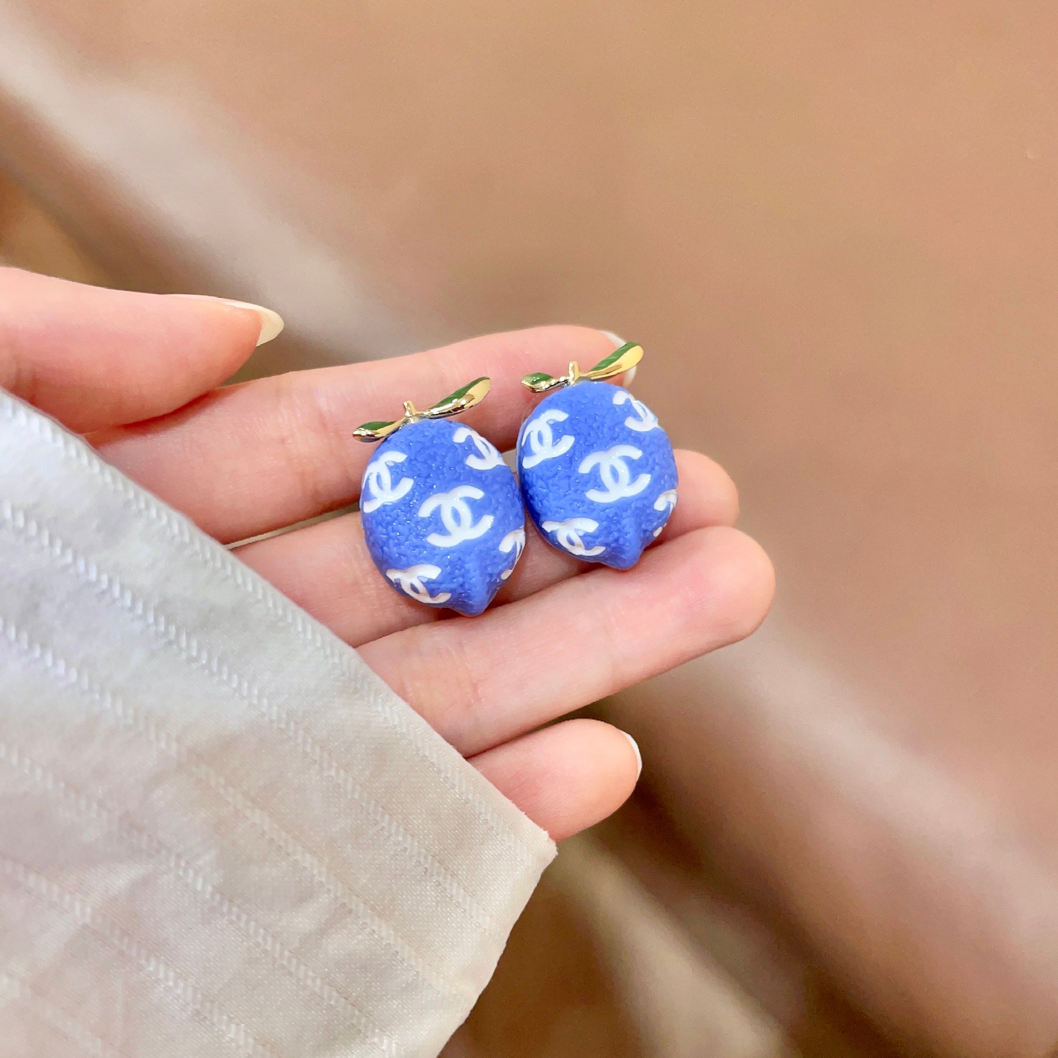 Chanel CC Lemon Stud Earrings earrings Gold-tone metal with blue enamel white interlocking CC logos green enamel leaf accents One Size