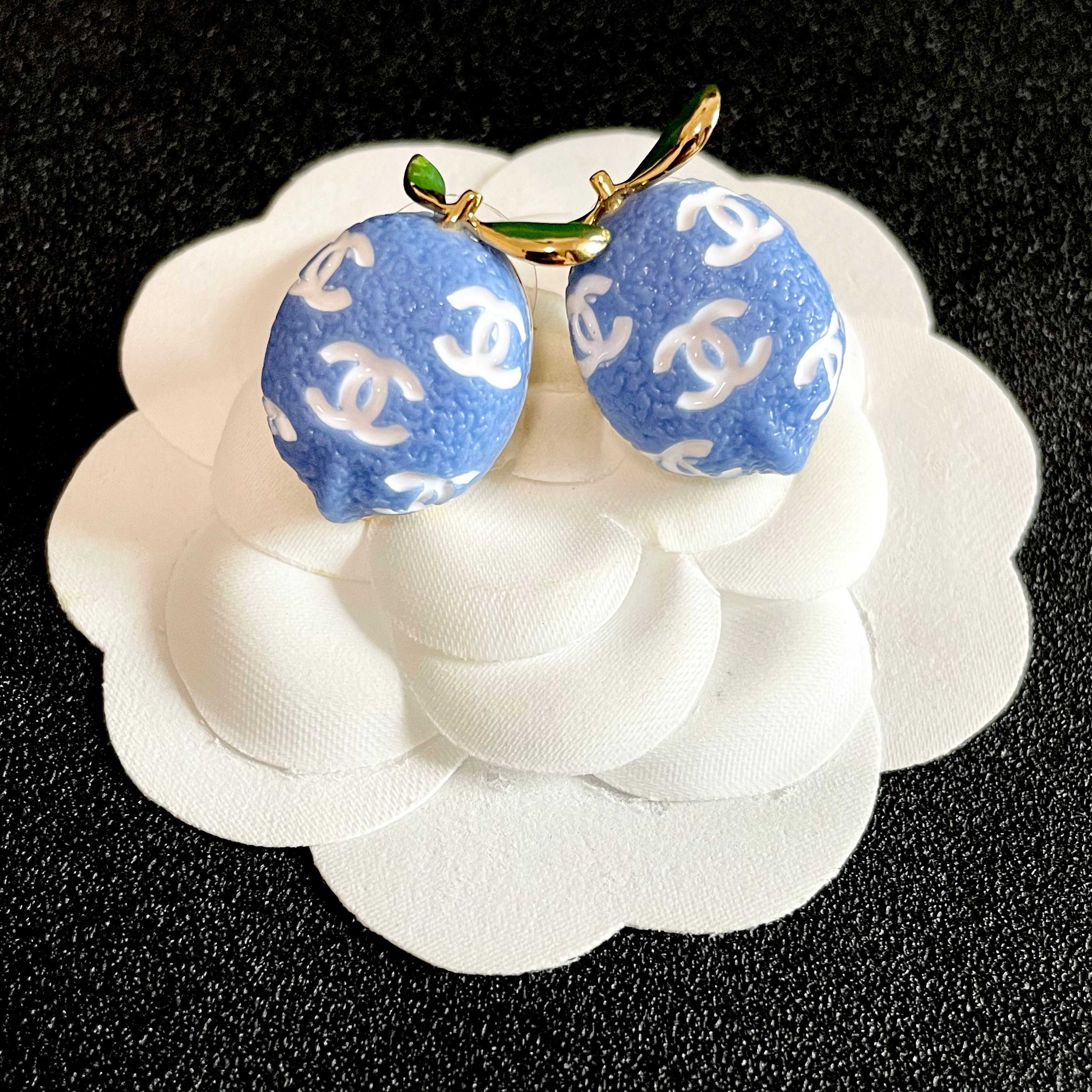 Chanel CC Lemon Stud Earrings earrings Gold-tone metal with blue enamel white interlocking CC logos green enamel leaf accents One Size