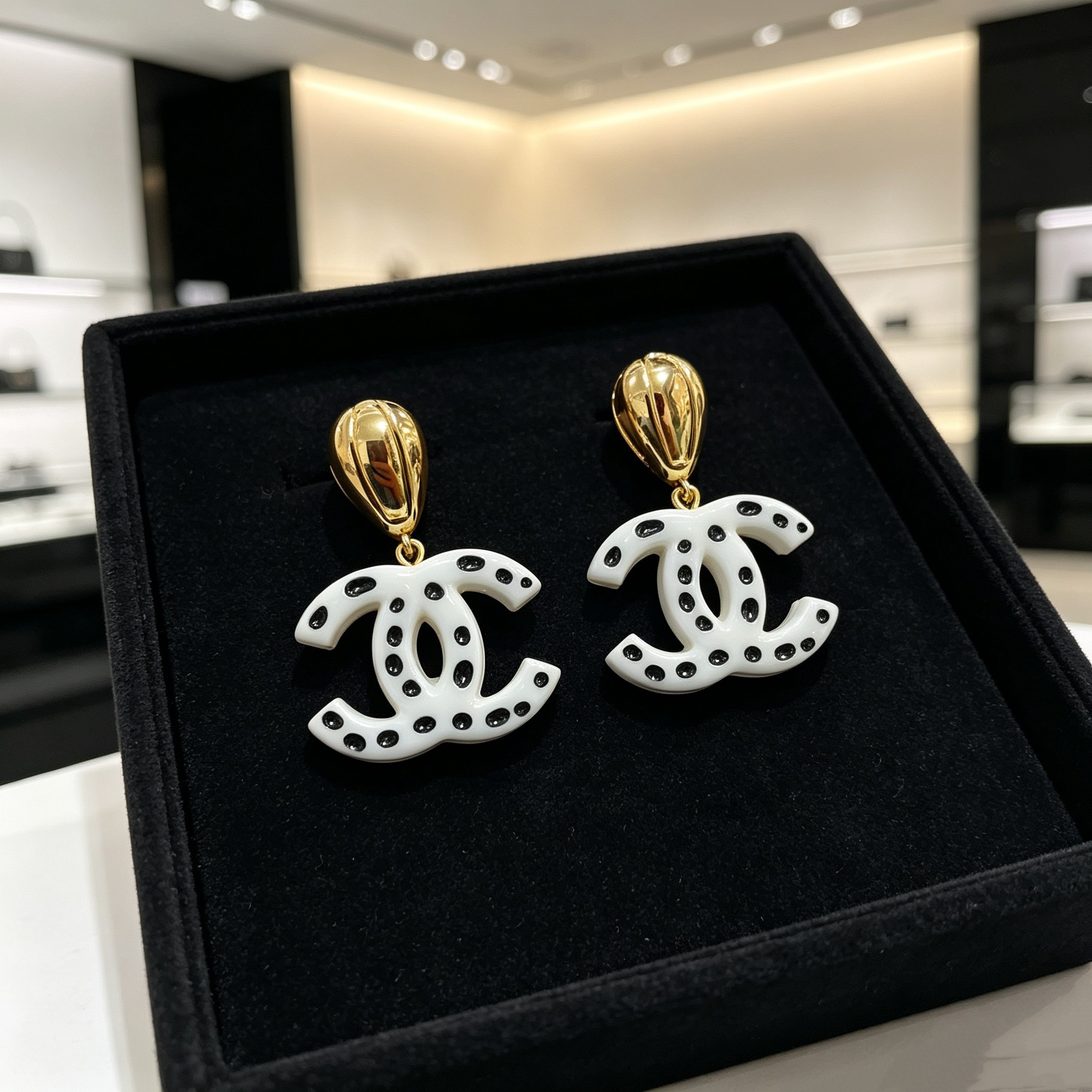 Chanel CC Drop Earrings Polka Dot earrings gold tone metal white resin with black polka dot accents 4 5cm drop length