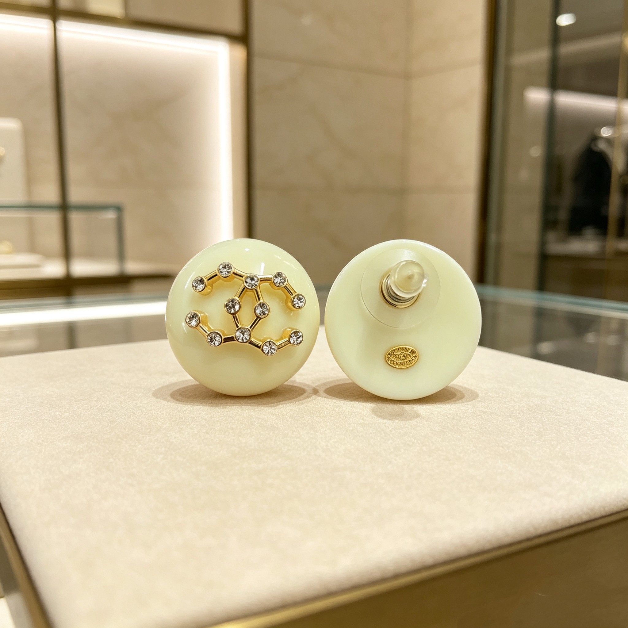 Chanel CC Logo Round Resin Stud Earrings earrings Cream ivory resin gold-tone metal clear crystal rhinestones 2 5cm diameter