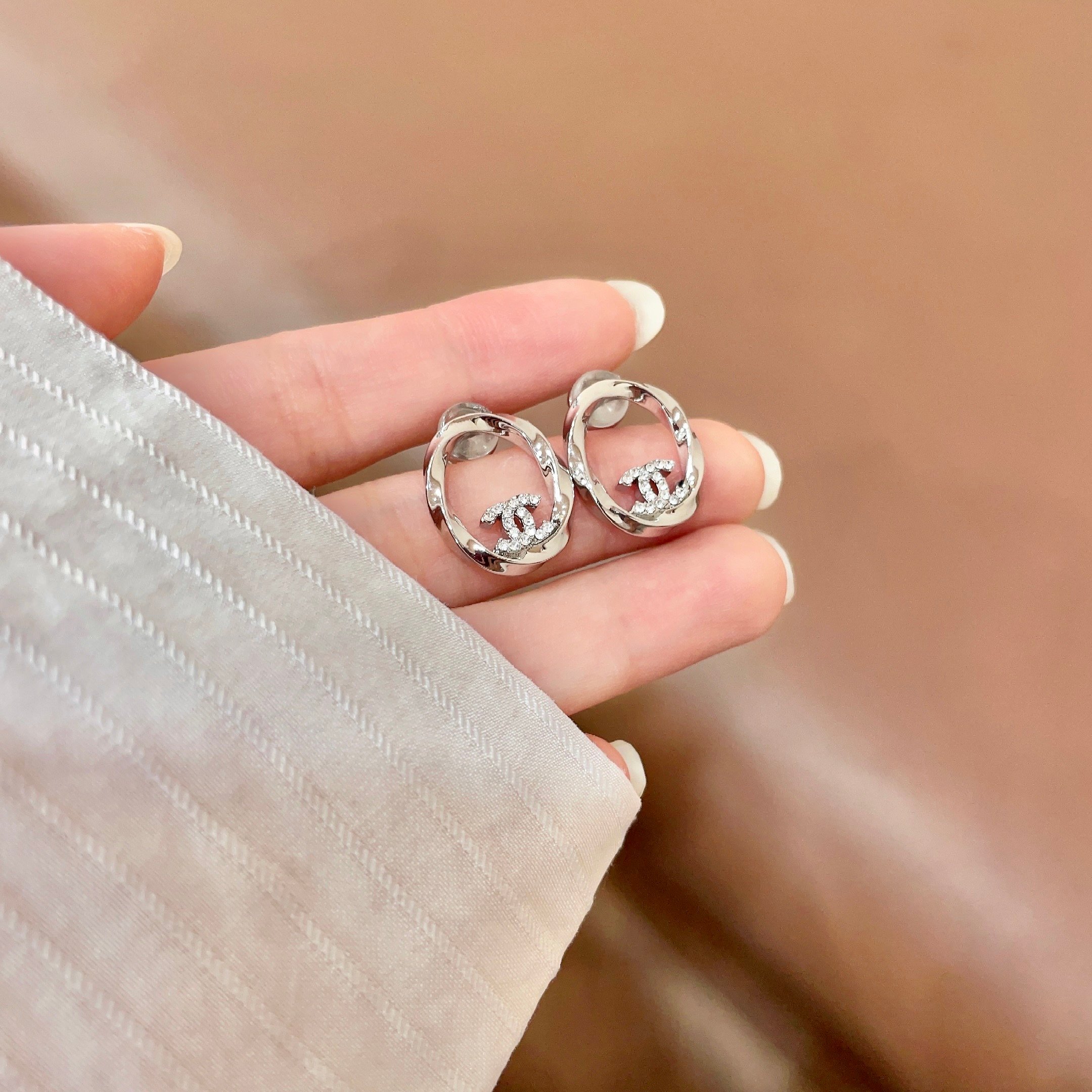 Chanel CC Twisted Open Hoop Earrings earrings silver-toned metal with clear crystal accents 1 5cm diameter