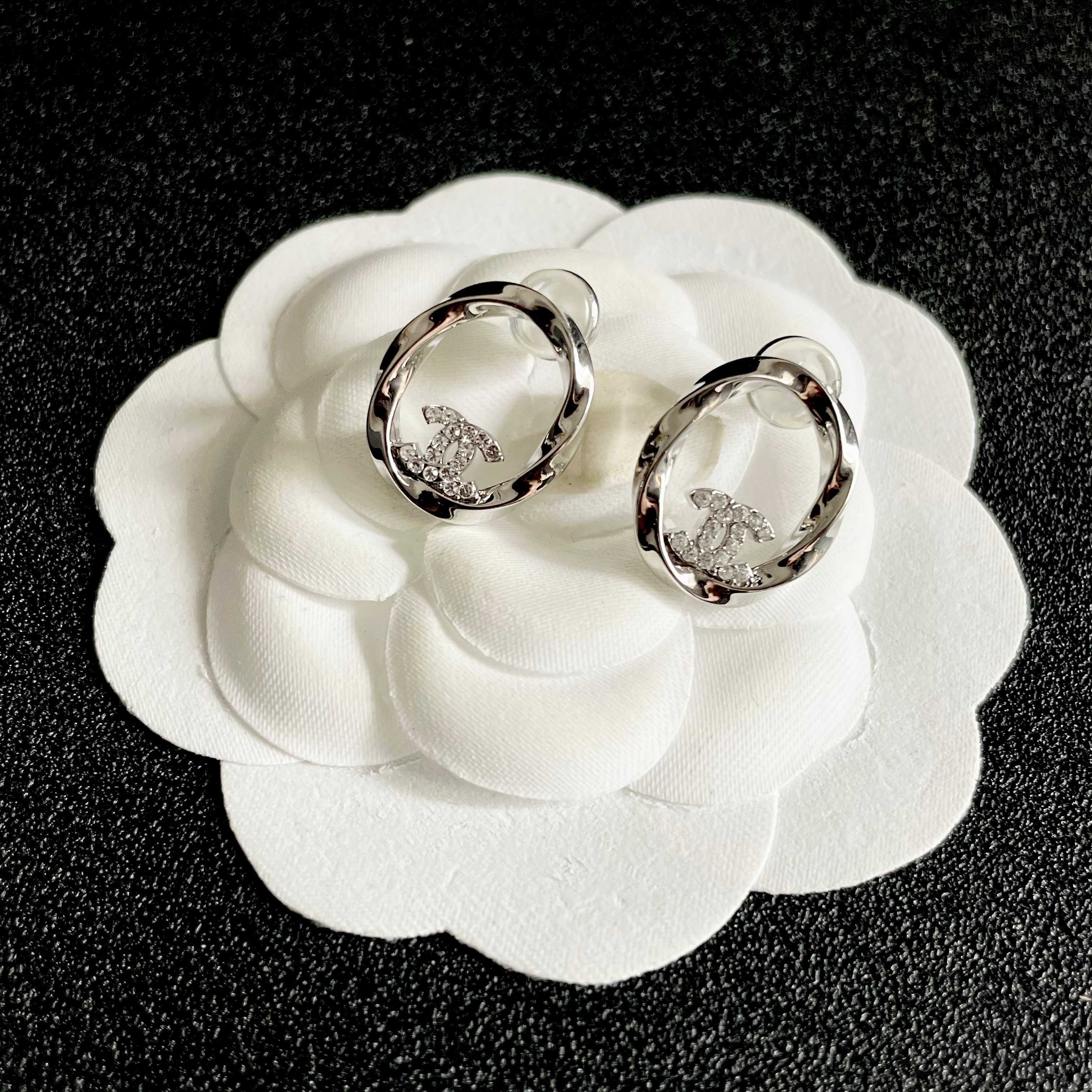 Chanel CC Twisted Open Hoop Earrings earrings silver-toned metal with clear crystal accents 1 5cm diameter