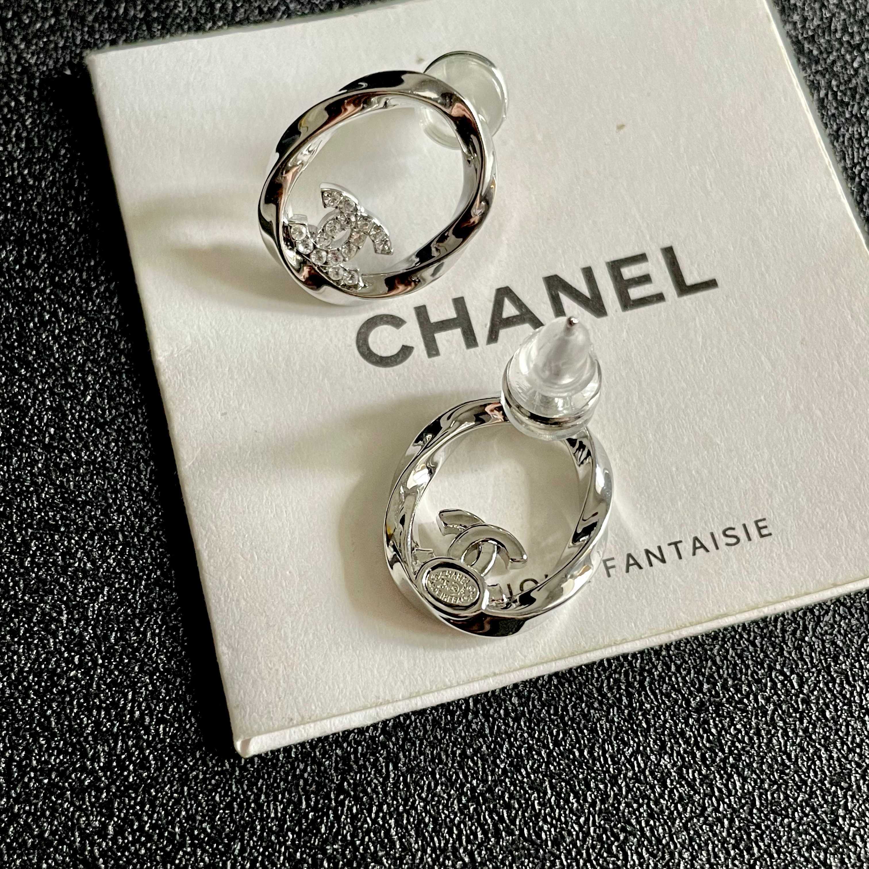 Chanel CC Twisted Open Hoop Earrings earrings silver-toned metal with clear crystal accents 1 5cm diameter
