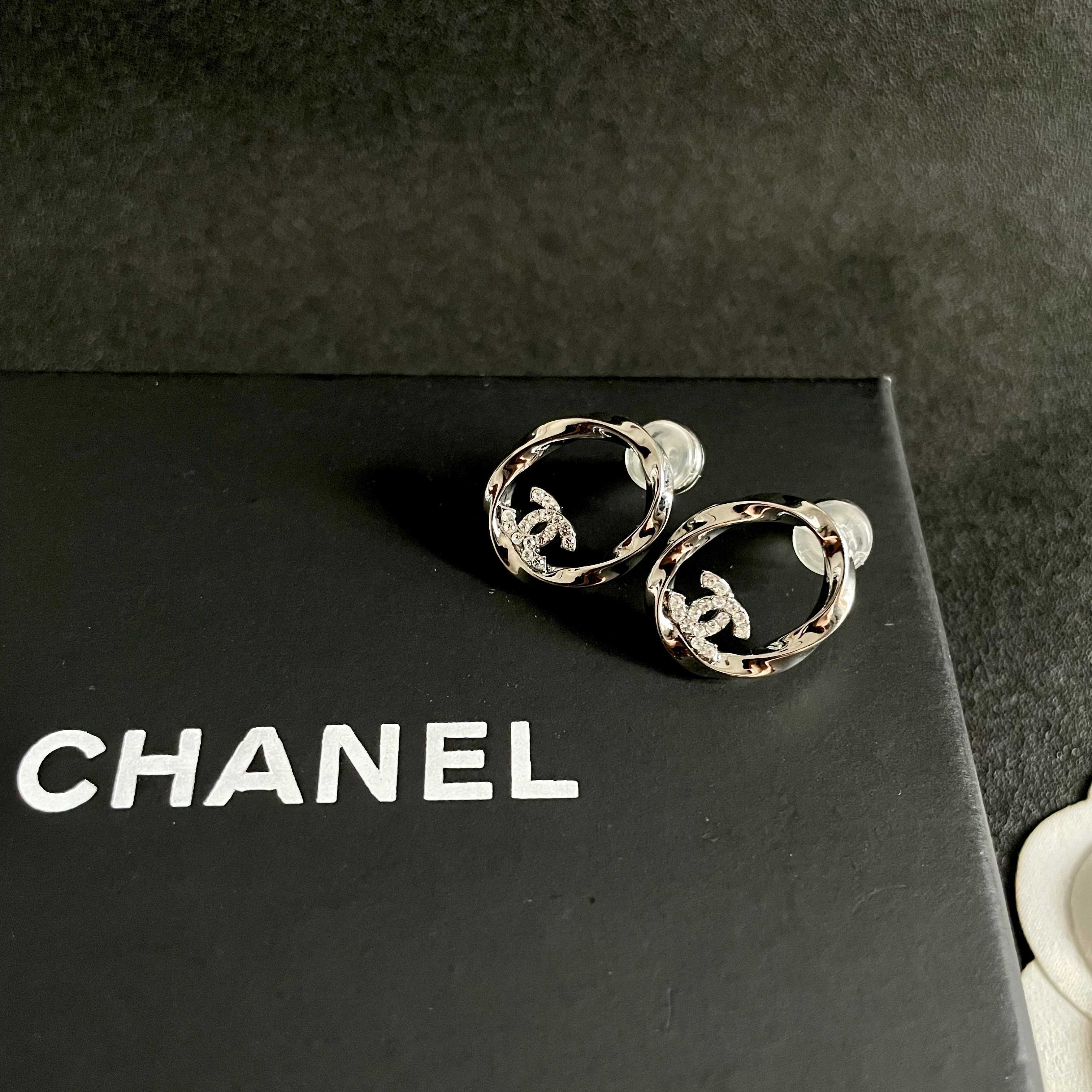 Chanel CC Twisted Open Hoop Earrings earrings silver-toned metal with clear crystal accents 1 5cm diameter
