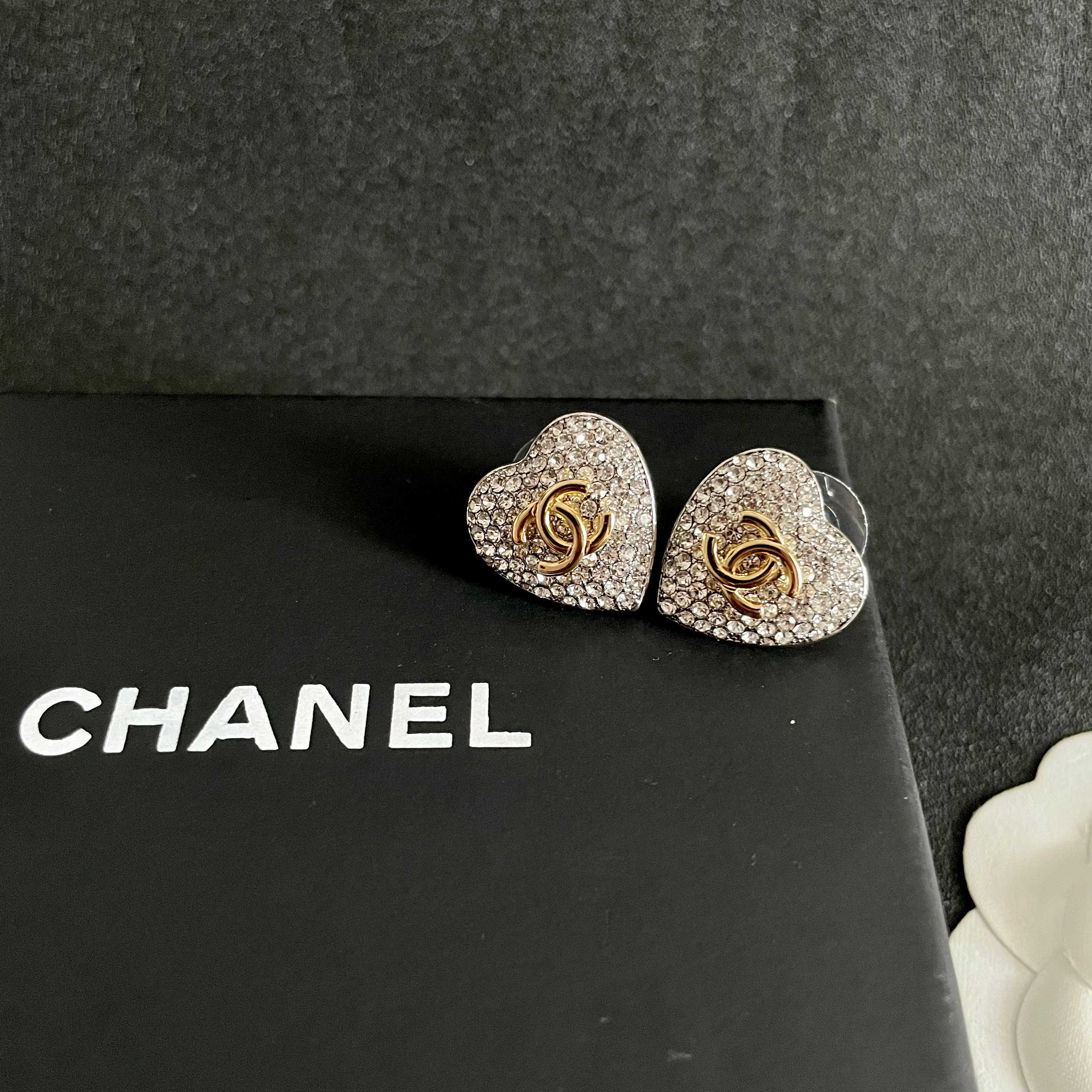 Chanel CC Heart Crystal Stud Earrings earrings silver-tone metal base gold-tone interlocking CC logo clear crystal pave 1 5cm diameter