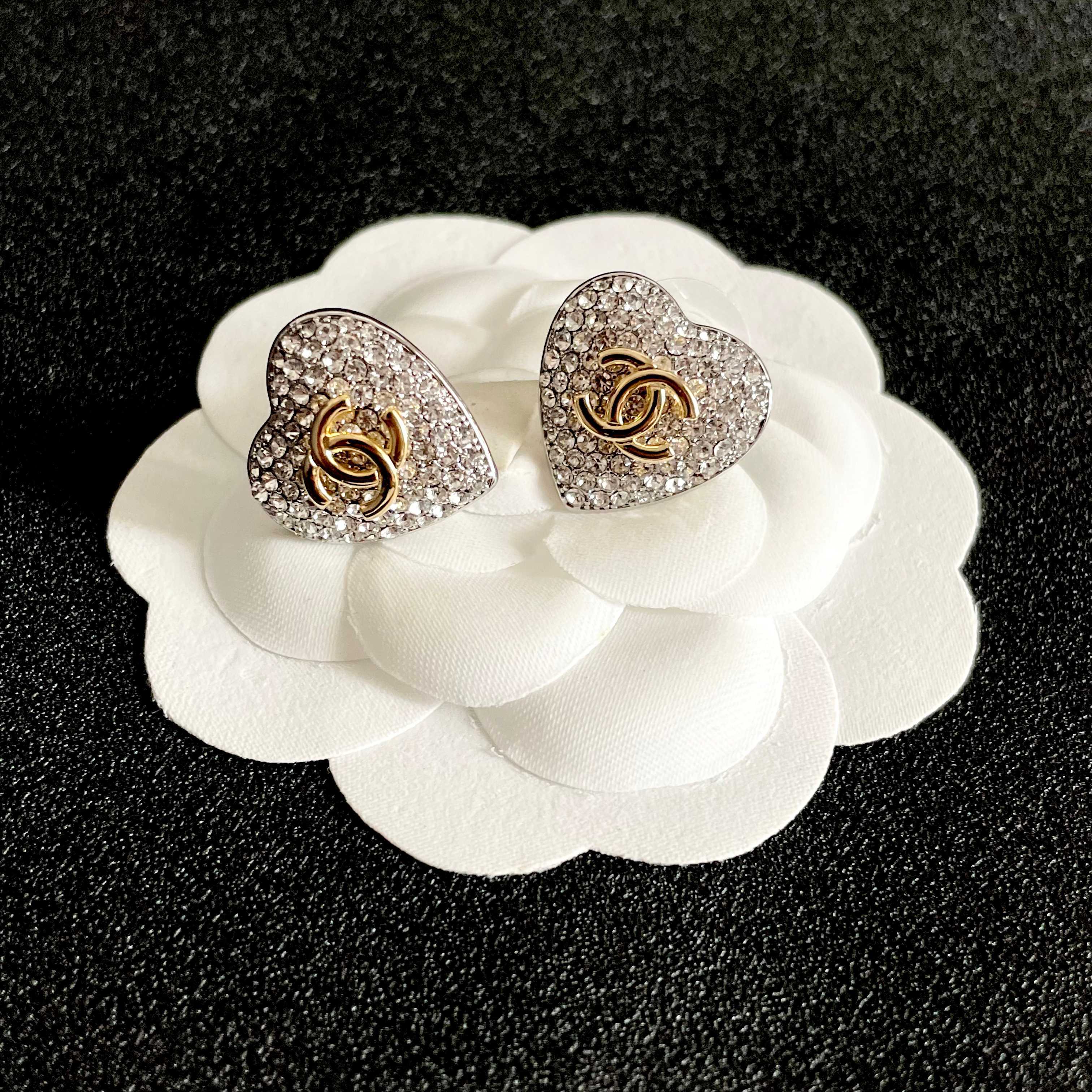 Chanel CC Heart Crystal Stud Earrings earrings silver-tone metal base gold-tone interlocking CC logo clear crystal pave 1 5cm diameter