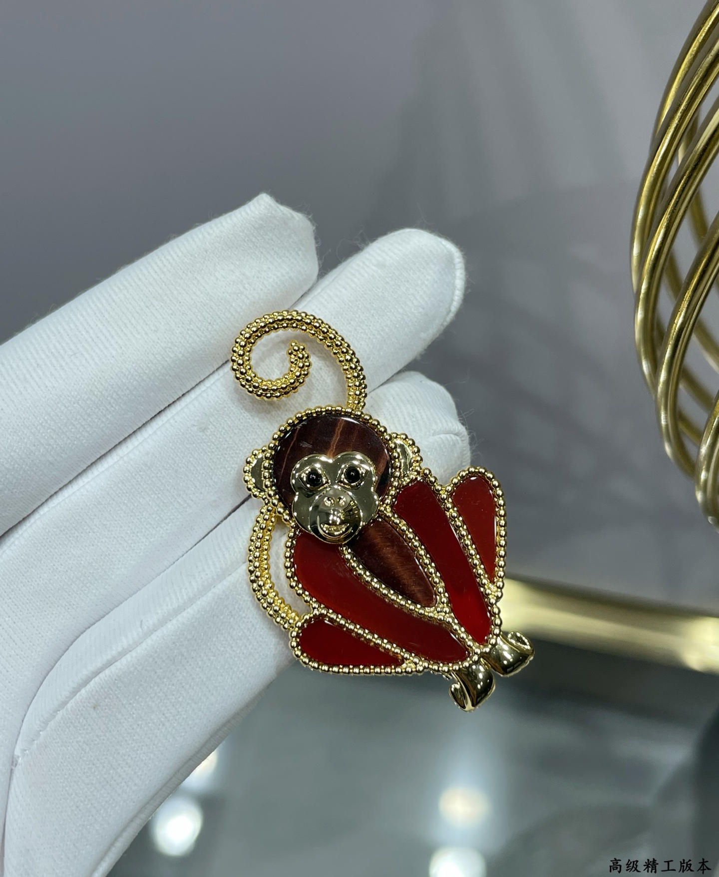 Van Cleef Arpels Lucky Animals Monkey brooch Yellow gold red carnelian brown wood black onyx 30mm x 20mm