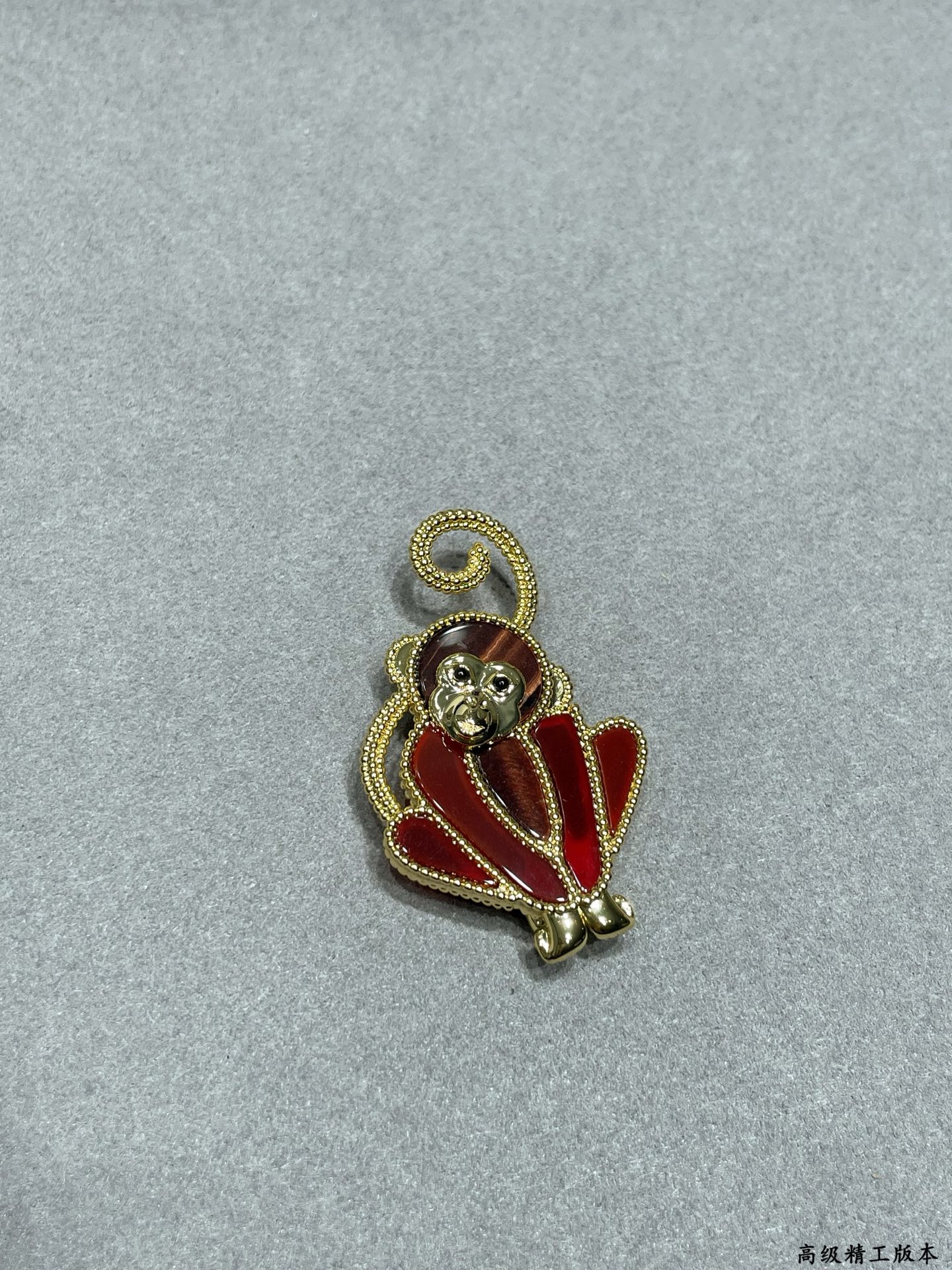 Van Cleef Arpels Lucky Animals Monkey brooch Yellow gold red carnelian brown wood black onyx 30mm x 20mm