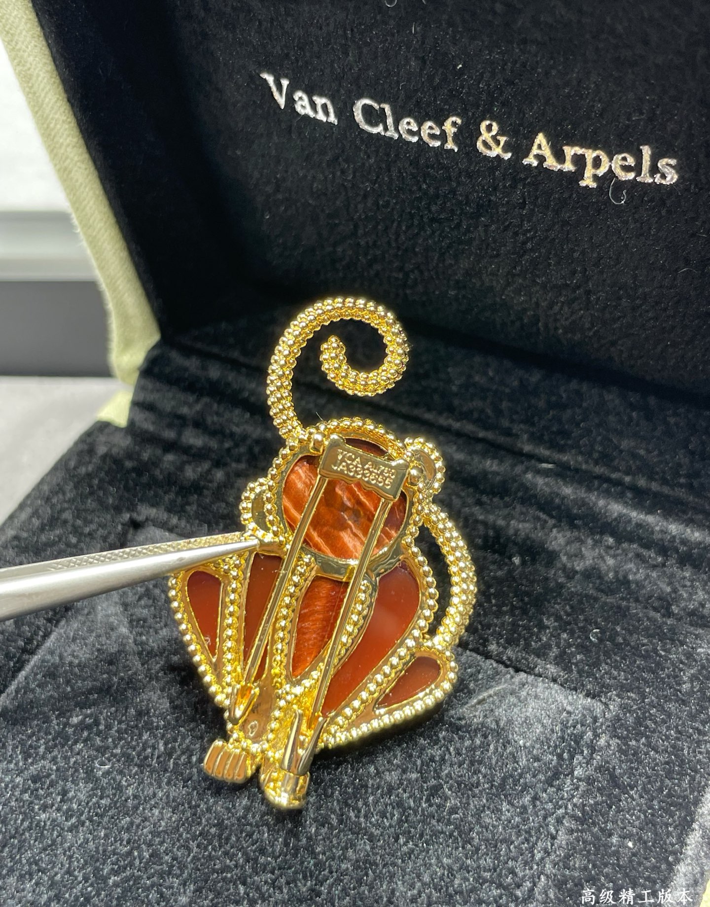 Van Cleef Arpels Lucky Animals Monkey brooch Yellow gold red carnelian brown wood black onyx 30mm x 20mm
