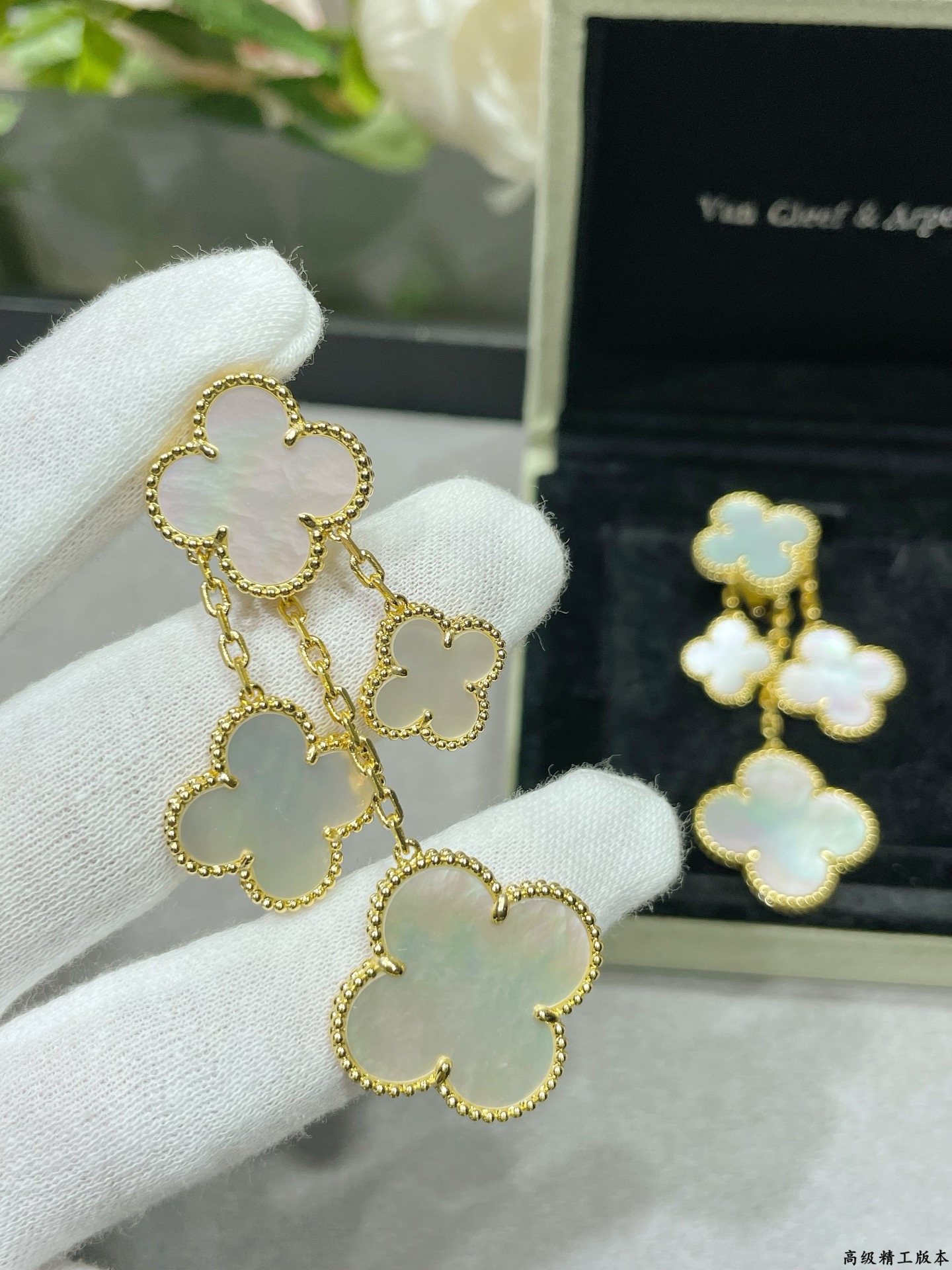 Van Cleef Arpels Magic Alhambra earrings Yellow gold white gold toned metal with white mother-of-pearl clover inlays 4 motifs per ear drop length approximately 6 5cm