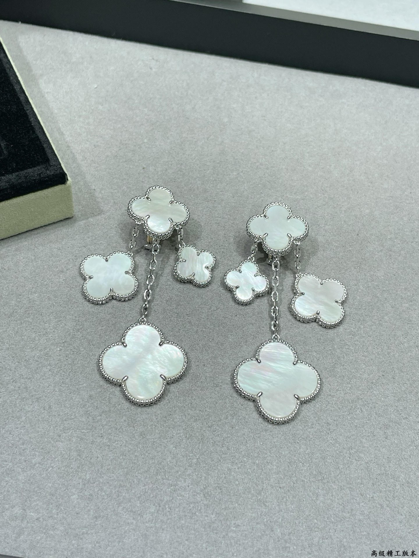 Van Cleef Arpels Magic Alhambra earrings Yellow gold white gold toned metal with white mother-of-pearl clover inlays 4 motifs per ear drop length approximately 6 5cm