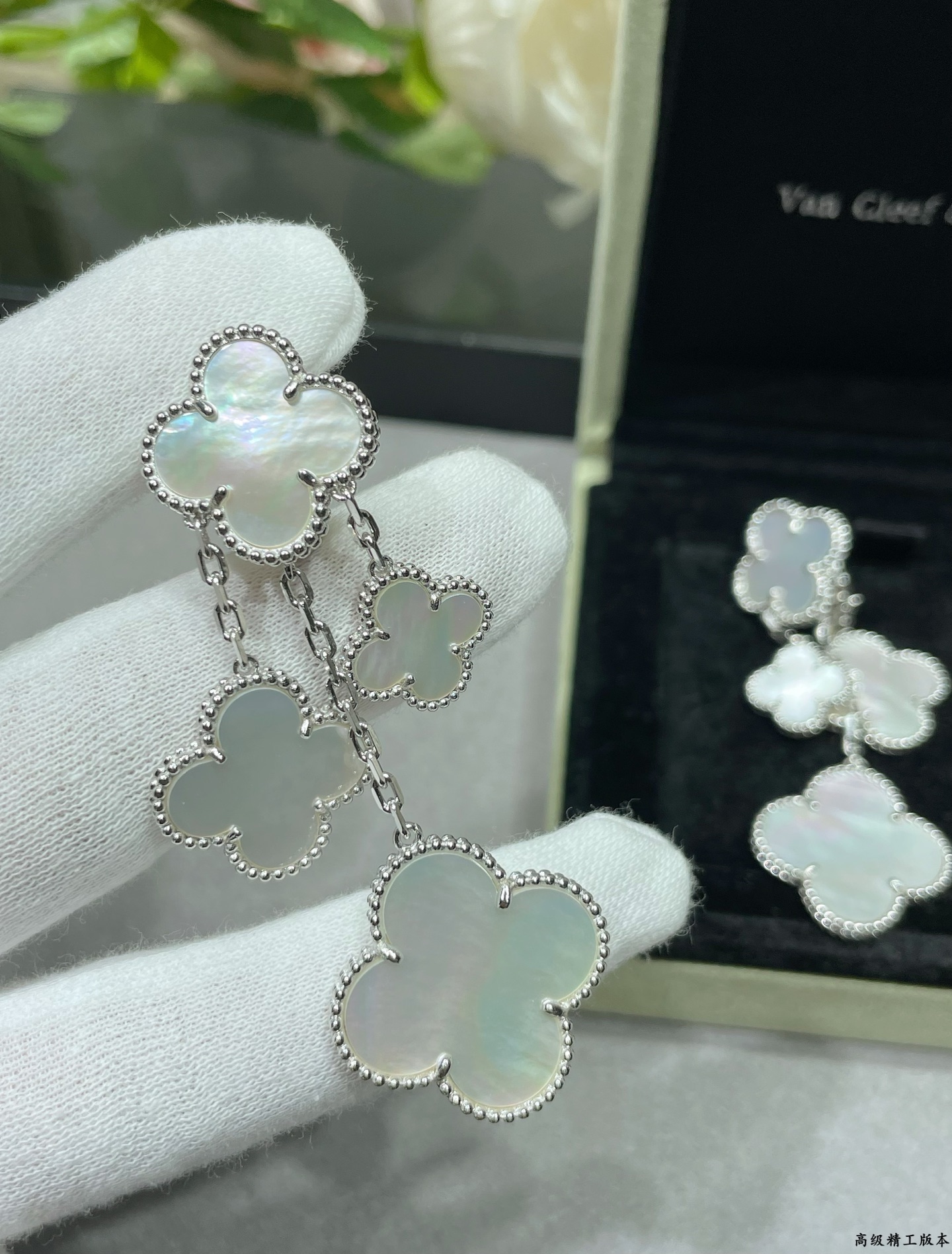 Van Cleef Arpels Magic Alhambra earrings Yellow gold white gold toned metal with white mother-of-pearl clover inlays 4 motifs per ear drop length approximately 6 5cm