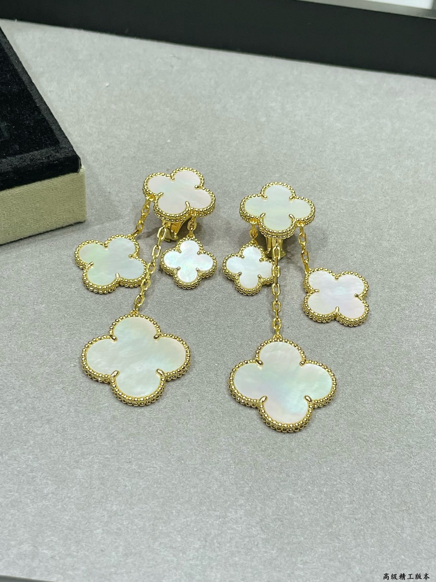 Van Cleef Arpels Magic Alhambra earrings Yellow gold white gold toned metal with white mother-of-pearl clover inlays 4 motifs per ear drop length approximately 6 5cm