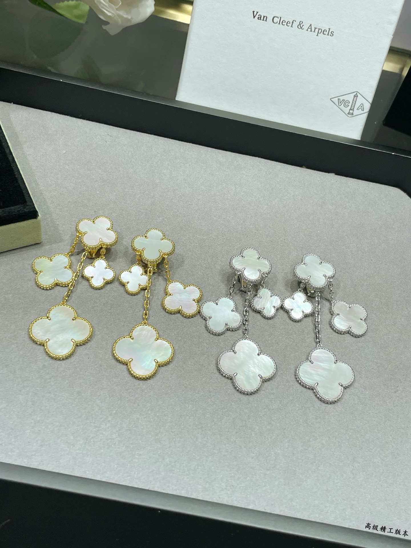 Van Cleef Arpels Magic Alhambra earrings Yellow gold white gold toned metal with white mother-of-pearl clover inlays 4 motifs per ear drop length approximately 6 5cm