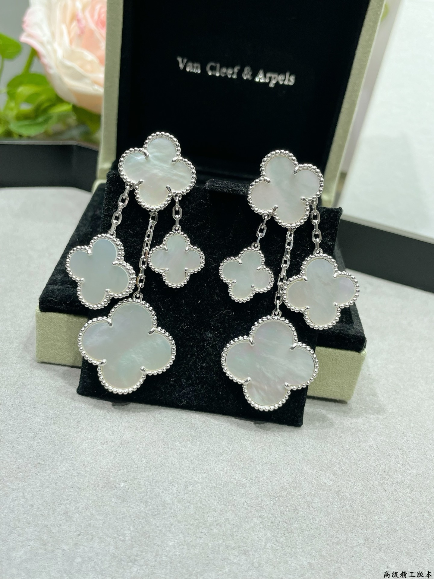 Van Cleef Arpels Magic Alhambra earrings Yellow gold white gold toned metal with white mother-of-pearl clover inlays 4 motifs per ear drop length approximately 6 5cm