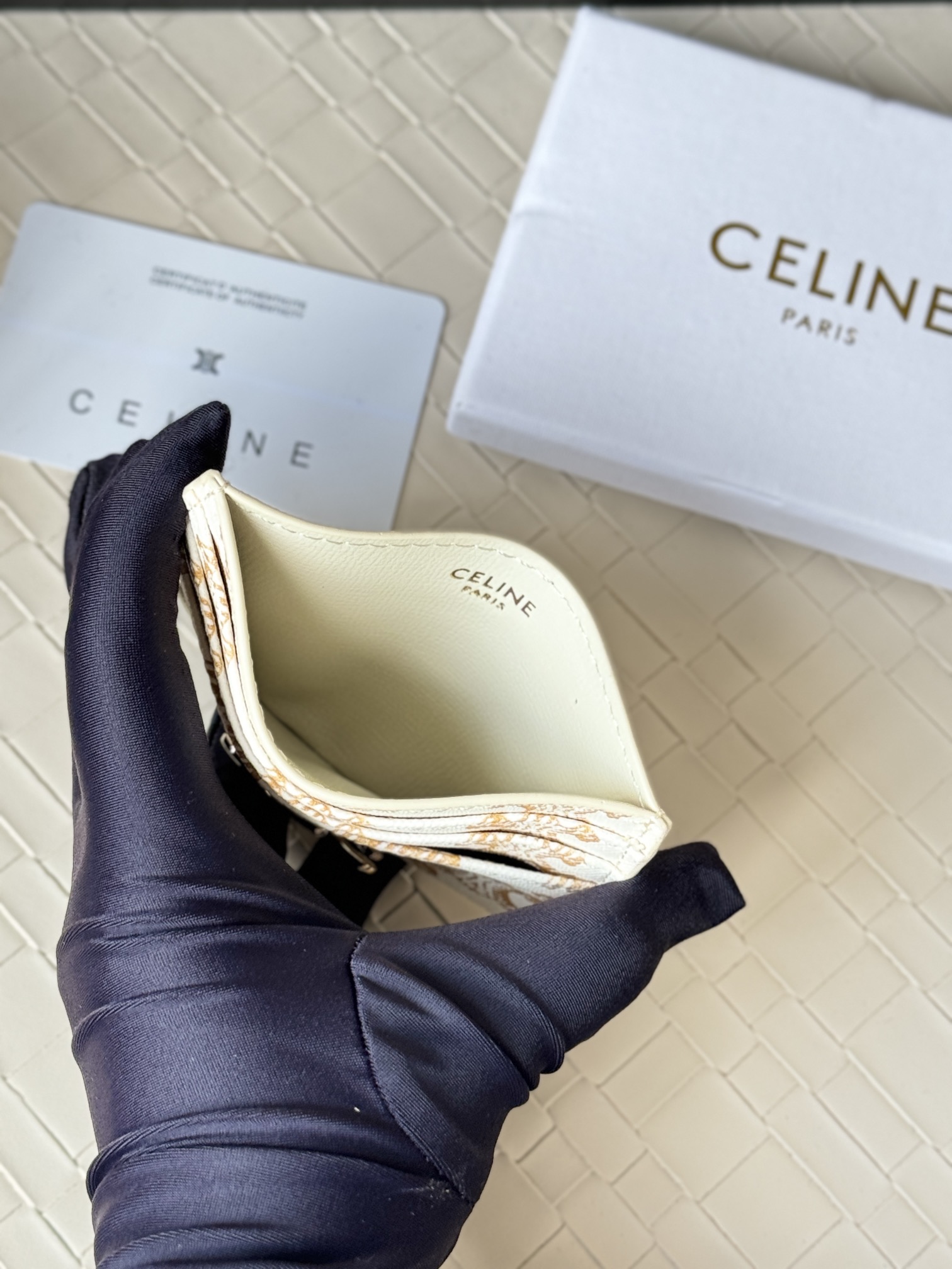 Celine Triomphe card holder white coated canvas with gold-tone Triomphe monogram print and gold-tone metal hardware 10cm x 7cm