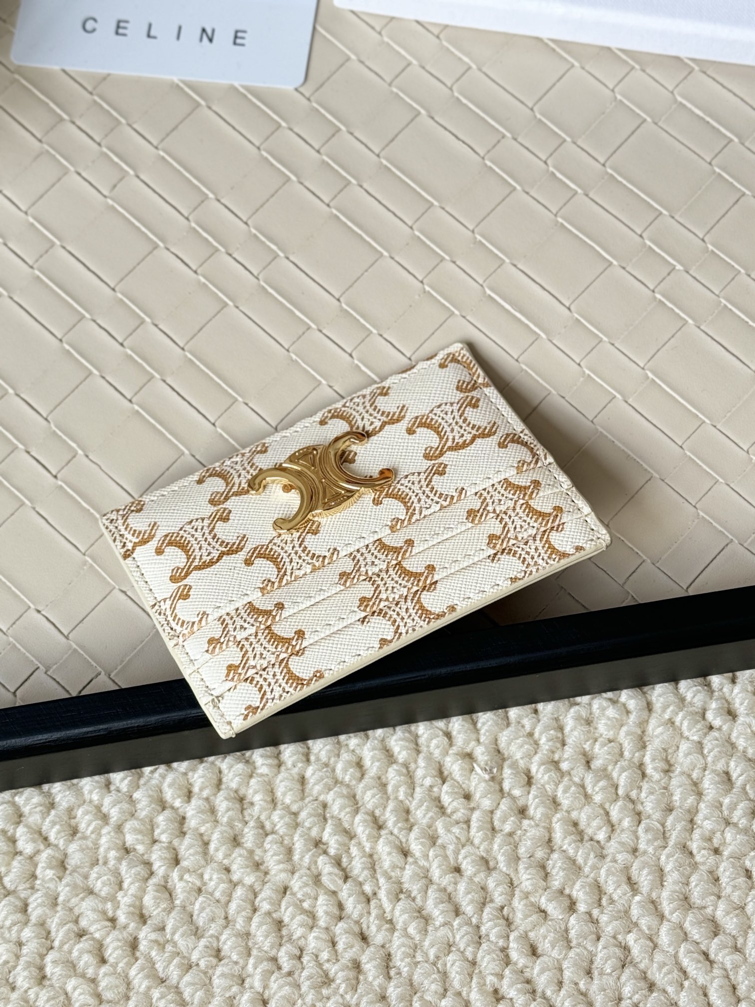 Celine Triomphe card holder white coated canvas with gold-tone Triomphe monogram print and gold-tone metal hardware 10cm x 7cm