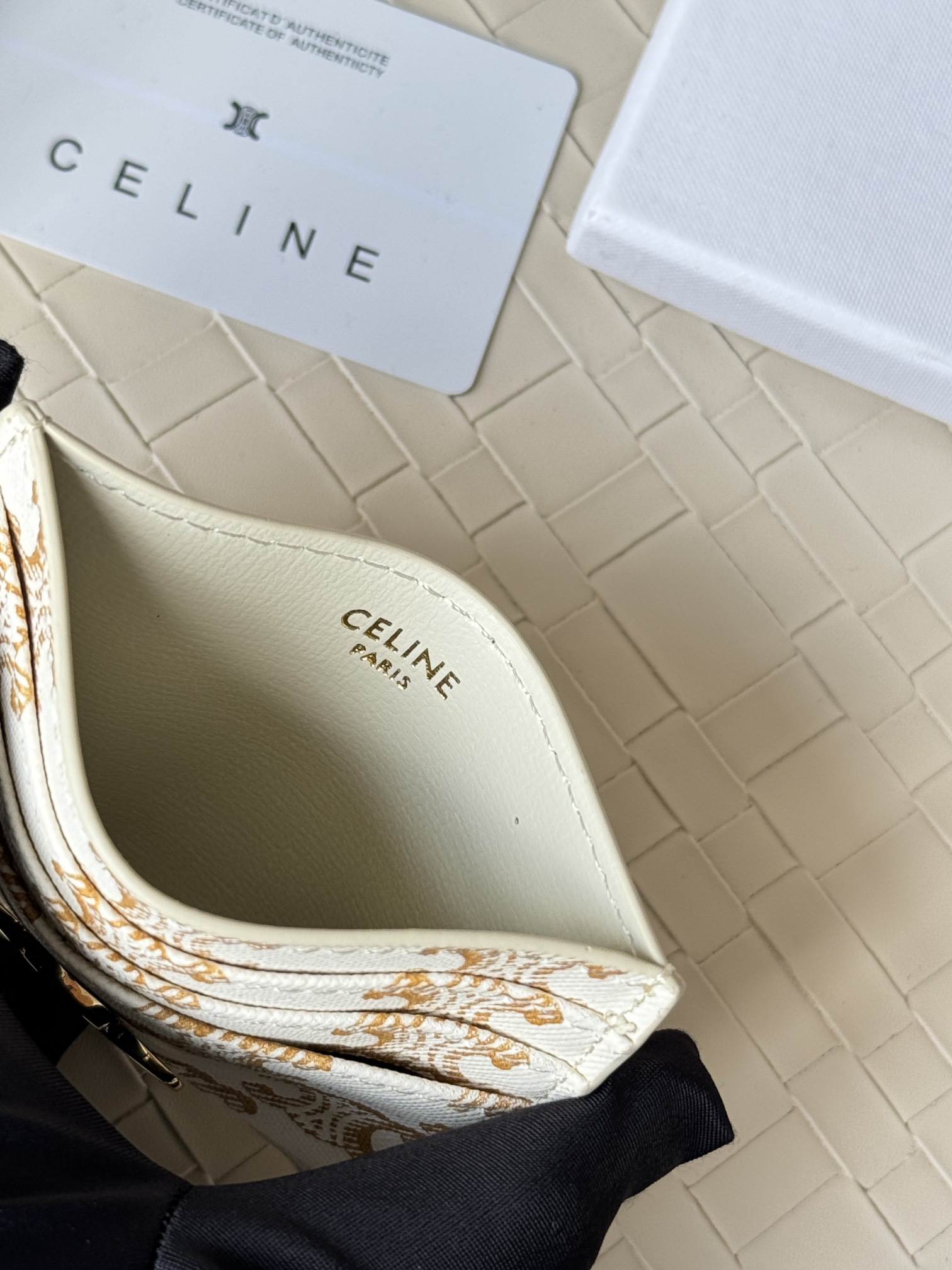 Celine Triomphe card holder white coated canvas with gold-tone Triomphe monogram print and gold-tone metal hardware 10cm x 7cm