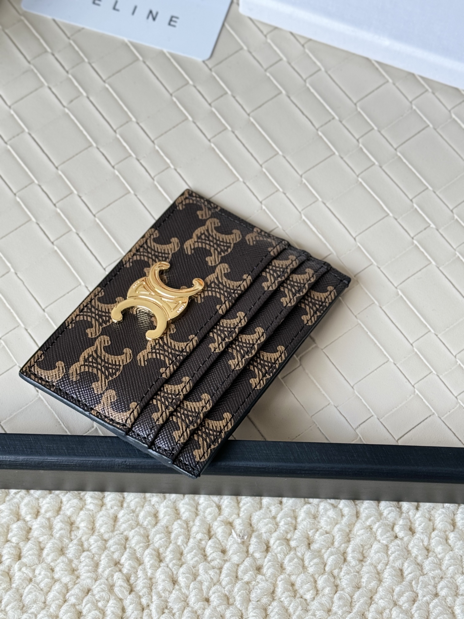 Celine Triomphe card holder dark brown coated canvas with tan Triomphe monogram gold-tone metal hardware black leather trim 10cm x 7 5cm