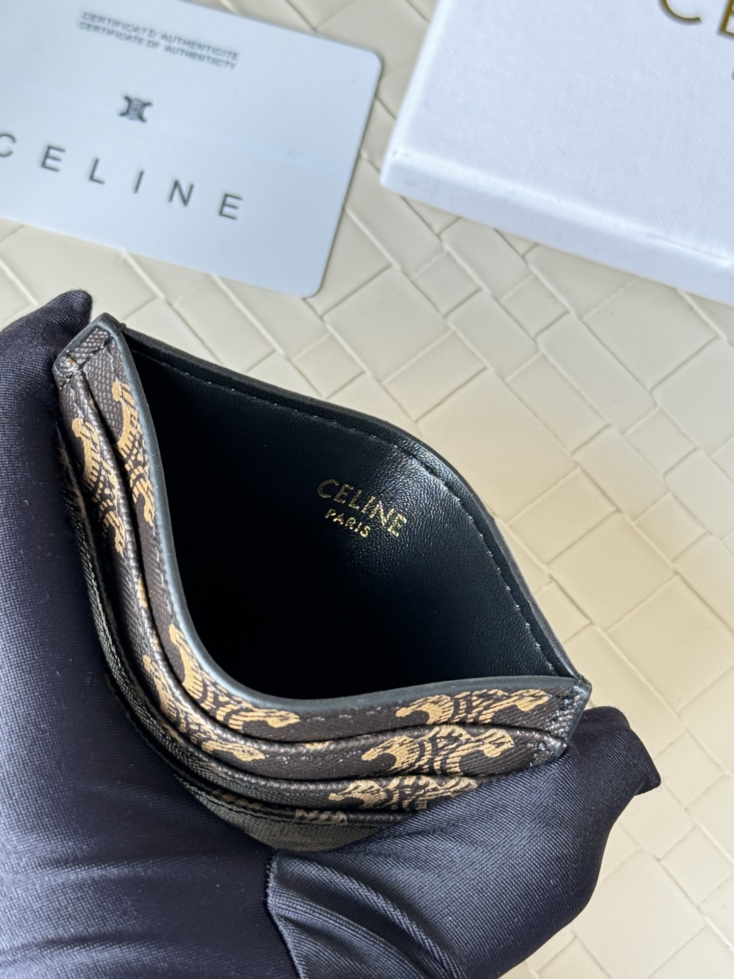 Celine Triomphe card holder dark brown coated canvas with tan Triomphe monogram gold-tone metal hardware black leather trim 10cm x 7 5cm