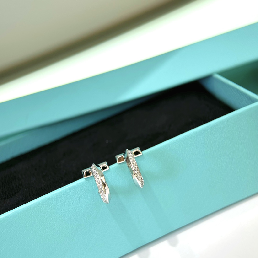 Tiffany T1 earrings silver-toned metal with clear diamond accents 12mm hoop diameter