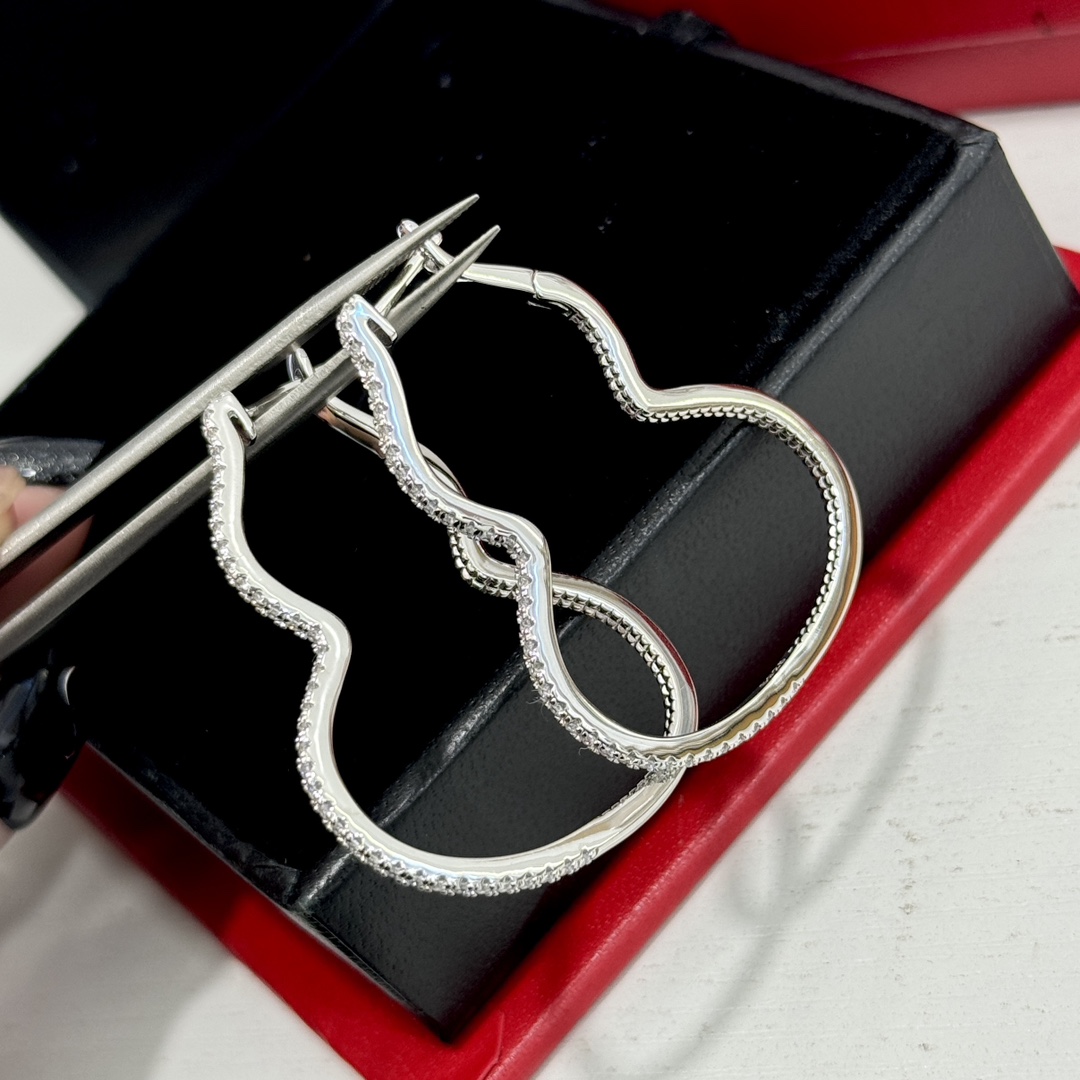 Qeelin Wulu earrings silver-toned metal with clear pave stones 4cm hoop length