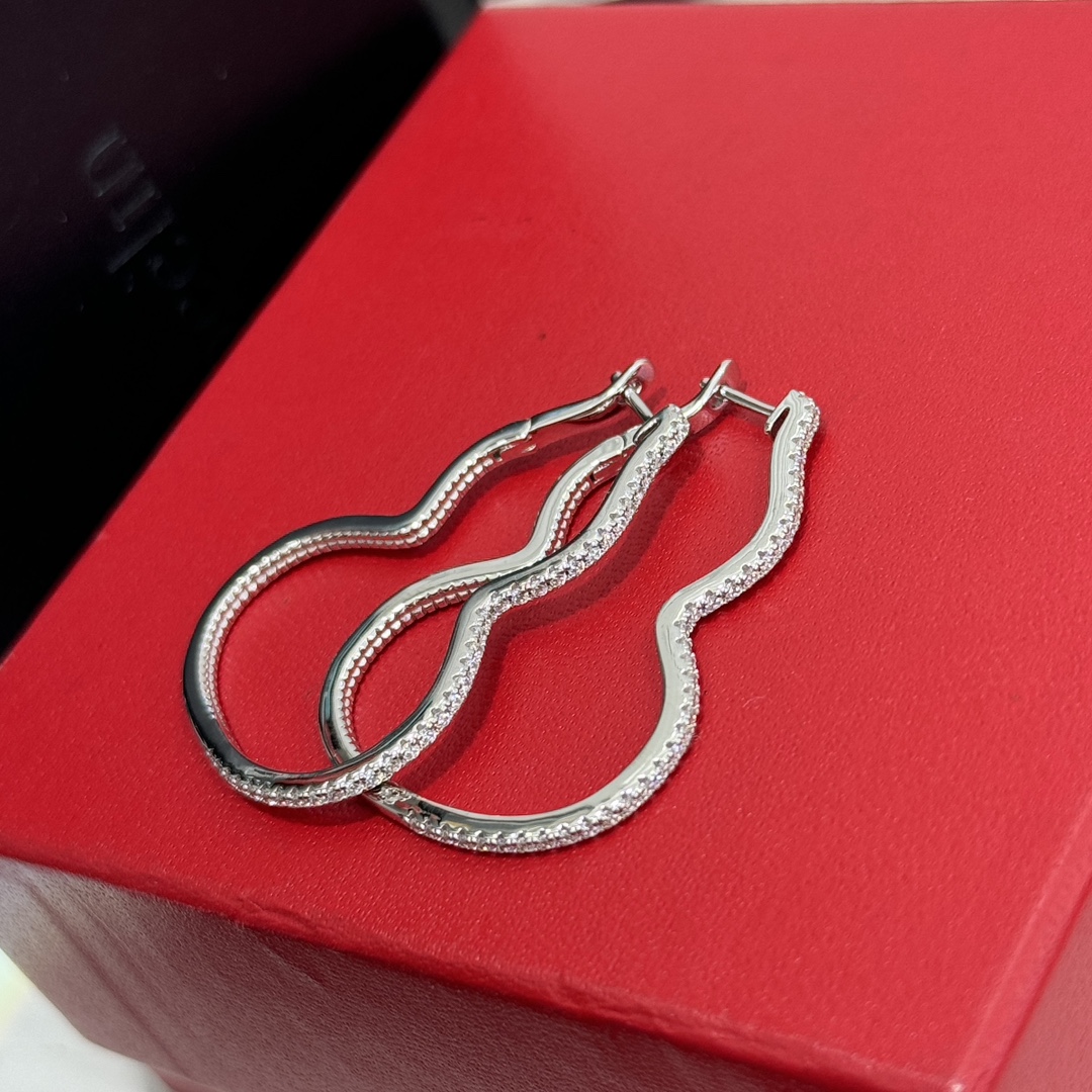 Qeelin Wulu earrings silver-toned metal with clear pave stones 4cm hoop length