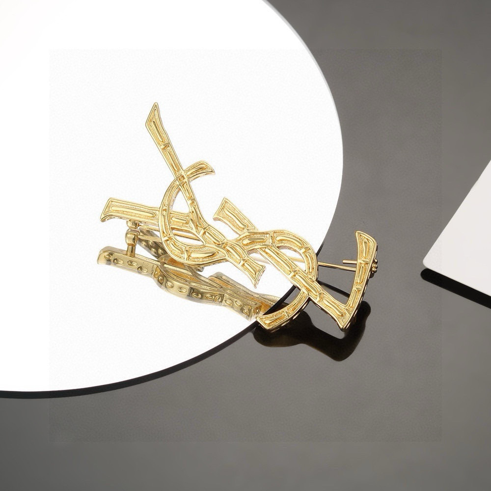 Saint Laurent Cassandre YSL Monogram Bamboo Textured Brooch brooch gold tone metal no accent stones 4 5cm width